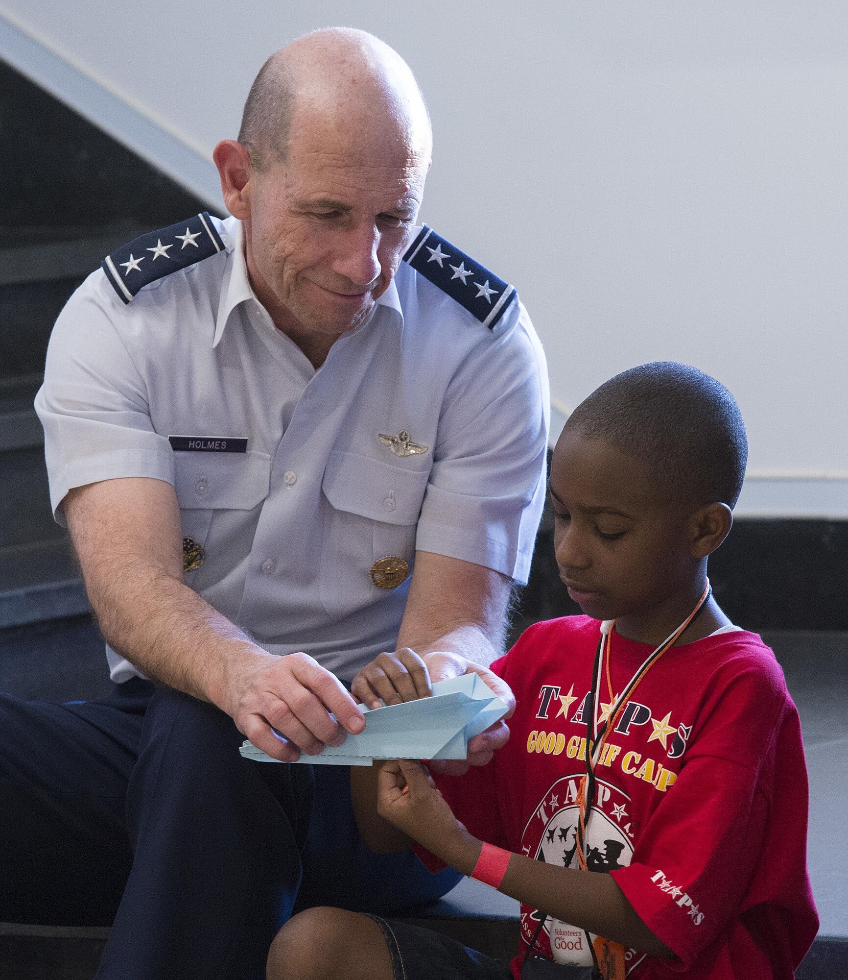 Lt. Gen. James M. Holmes, the deputy chief of staff for strategic plans and requirements, hosted the Air Force portion of a 21st Annual Tragedy Assistance Program for Survivors (TAPS) Military Survivor Seminar and Good Grief Camp for Young Survivors event at the Pentagon in Washington, D.C., May 22, 2015.  The TAPS Good Grief Camp for children and teens provides a safe and supportive atmosphere for kids to learn coping skills, establish and identify support systems, and create awareness that they are not alone in their grief. (U.S. Air Force photo/Jim Varhegyi)