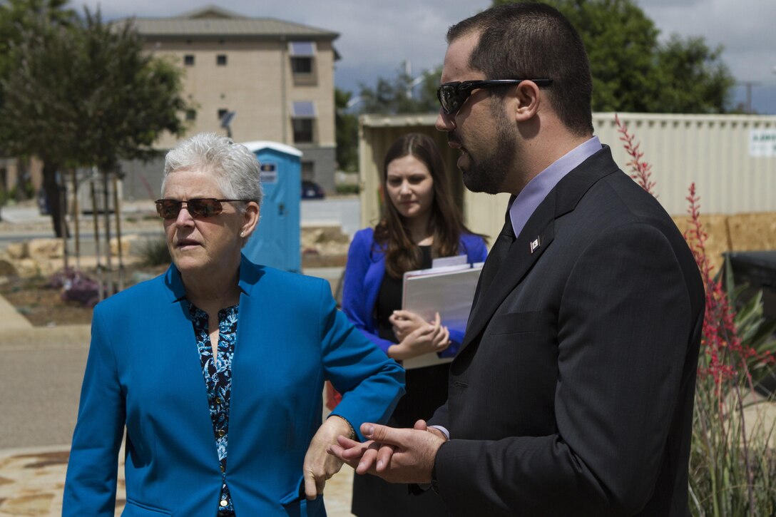 Mick Wasco, the Marine Corps Air Station Miramar Energy Program Manager, talks to Gina McCarthy, the U.S. Environmental Protection Agency Administrator, about reclaimed water and water conservation efforts the air station currently implements at the public works building aboard MCAS Miramar, California, May 20. McCarthy awarded the station the 2015 EPA Federal Green Challenge Award for Energy.