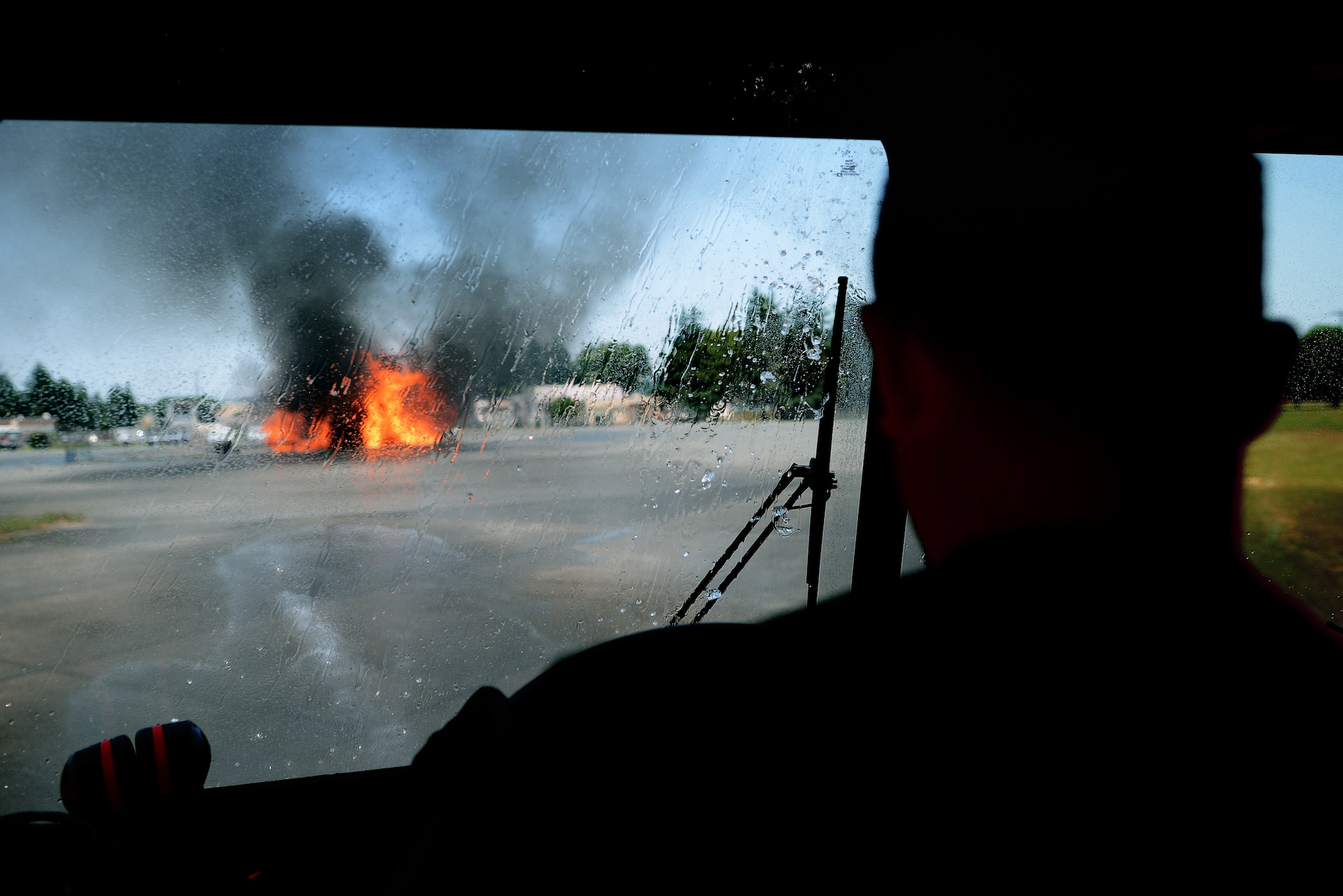 374th Civil Engineer Squadron firefighters arrive at the scene of a joint fire training exercise May 26, 2015, at Yokota Air Base, Japan. 374 CES firefighters battled a simulated aircraft fire alongside their Japan Air Self-Defense Force peers. (U.S. Air Force photo by Airman 1st Class Delano Scott/Released)