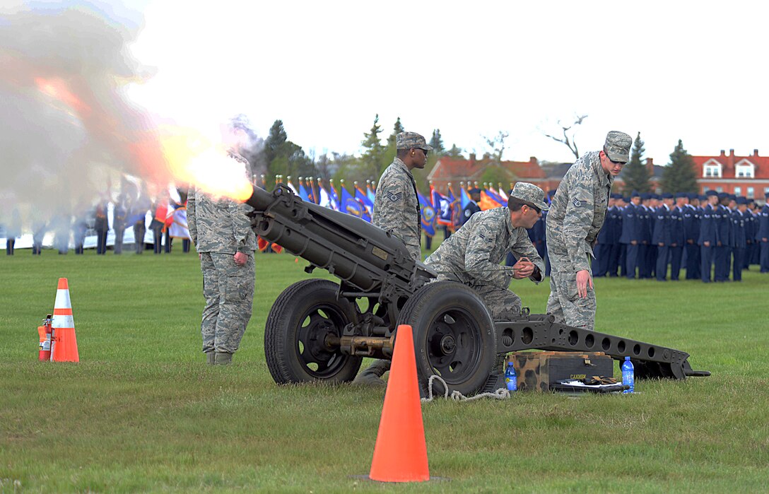 Ninetieth Munitions Squadron conventional ammunition Airmen operate a cannon during the 90th Missile Wing change of command May 27, 2015, on the Argonne Parade Field, F.E. Warren Air Force Base, Wyo. The cannon sounded as Maj. Gen. Jack Weinstein, Task Force 214 and 20th Air Force commander, passed the 90th Missile Wing guidon to the incoming commander, Col. Stephen M. Kravitsky. (U.S. Air Force photo by Senior Airman Jason Wiese)