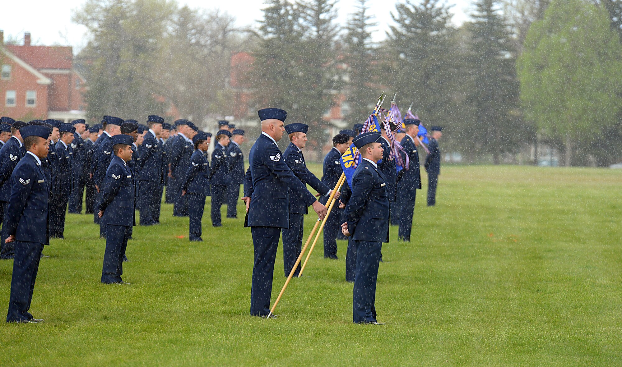 Ninetieth Missile Wing Airmen stand at parade rest on the Argonne Parade Field, F.E. Warren Air Force Base, Wyo., during a wing change of command ceremony May 27, 2015. Col. Stephen M. Kravitsky assumed command of the wing during the ceremony. (U.S. Air Force photo by Senior Airman Jason Wiese)