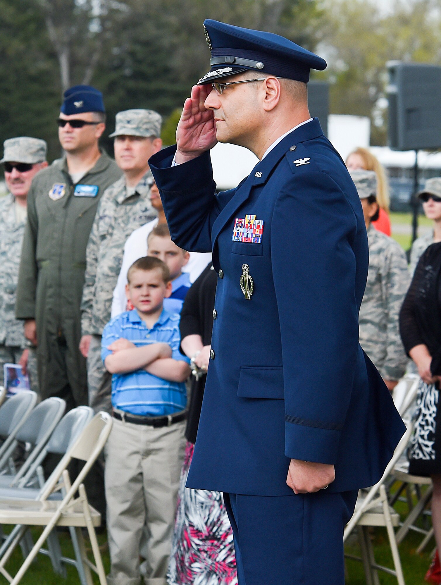 Col. Stephen M. Kravitsky, 90th  Missile Wing commander, returns the first salute given to him by his wing during a change of ceremony on F.E. Warren Air Force Base, Wyo., May 27, 2015. (U.S. Air Force photo by R.J. Oriez)