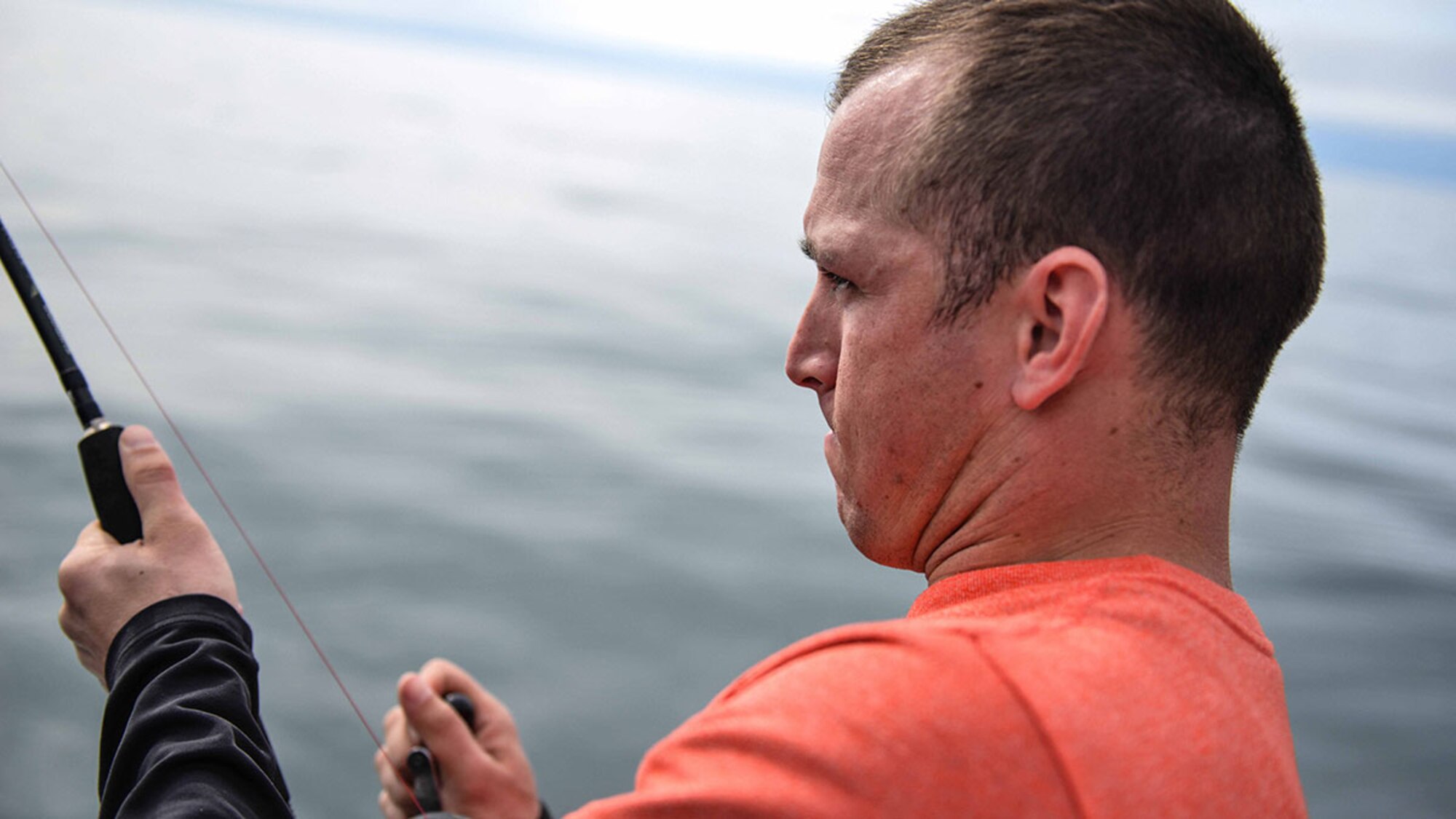 Staff Sgt. Adam Edmonds, an instrument flight control system craftsman with the 517th Aircraft Maintenance Unit, and native of Mason, AZ fishes out of the water outside Seward, Alaska May 20 as part of the 2015 Annual Armed Services Combat Fishing Tournament. Military service members compete for a plethora of awards, including a $2,000 randomly selected fish weight. (U.S. Air Force photo/Airman 1st Class Kyle Johnson)



