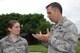 Just after a storm passed by the base, Col. Karl Goerke (right), commander of the 932nd Airlift Wing, discussed the latest weather outlook and storm patterns with Maj. Laura Maddin, who is commander of the 12th Operational Weather Flight at the Illinois reserve unit.  Her unit practices taking over forecasting services for the National Weather Service office in Oklahoma, in case of emergency or disaster that might happen.  The 932nd Airlift Wing is an Air Force Reserve unit located at Scott Air Force Base. (U.S. Air Force photo/Maj. Stan Paregien)