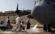 Staff Sgt. Ryan Lindsey, 362nd Training Squadron airlift instructor, trains his students on servicing a C-130 Hercules with liquid oxygen May 27, 2015, at Sheppard Air Force Base, Texas. The liquid oxygen is extremely cold with a boiling point of negative 297 degrees Fahrenheit and will be a part of the Airmen's everyday tasks when they graduate technical school and join operational flight lines across the Air Force. (U.S. Air Force photo by Danny Webb/ Released)