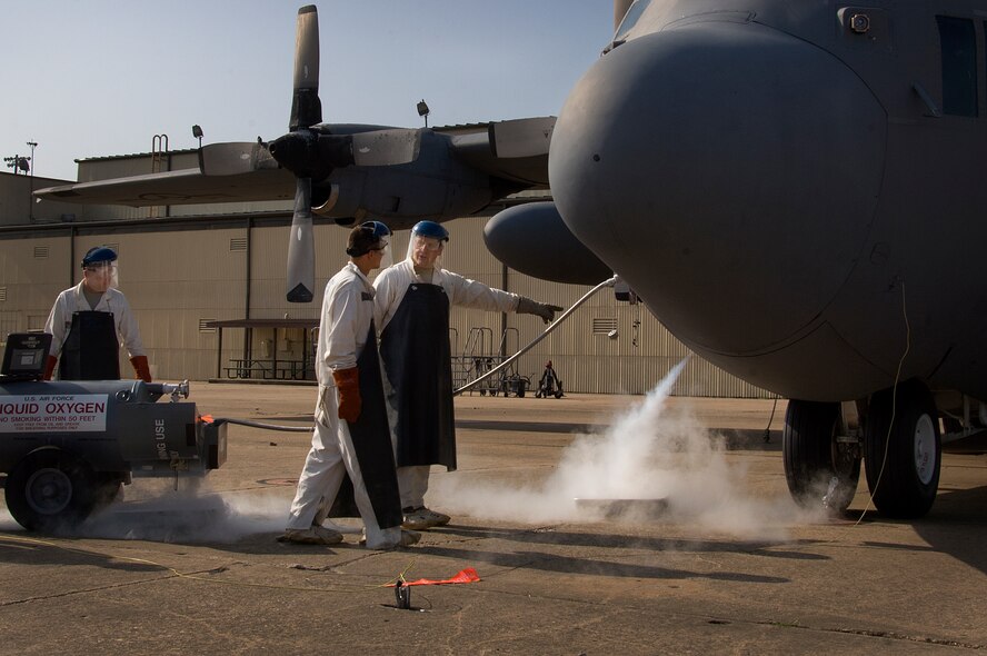Staff Sgt. Ryan Lindsey, 362nd Training Squadron airlift instructor, trains his students on servicing a C-130 Hercules with liquid oxygen May 27, 2015, at Sheppard Air Force Base, Texas. The liquid oxygen is extremely cold with a boiling point of negative 297 degrees Fahrenheit and will be a part of the Airmen's everyday tasks when they graduate technical school and join operational flight lines across the Air Force. (U.S. Air Force photo by Danny Webb/ Released)