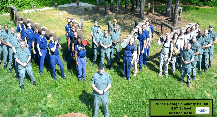 Emergency services members from the National Capital Region pose for a class photo at the Prince George County emergency services course, held April 27 through May 15, 2015, in Prince George County, Md. Five Airmen from the 11th Security Forces Group at Joint Base Andrews attended the course and received the Most Fit Team Award. (courtesy photo)