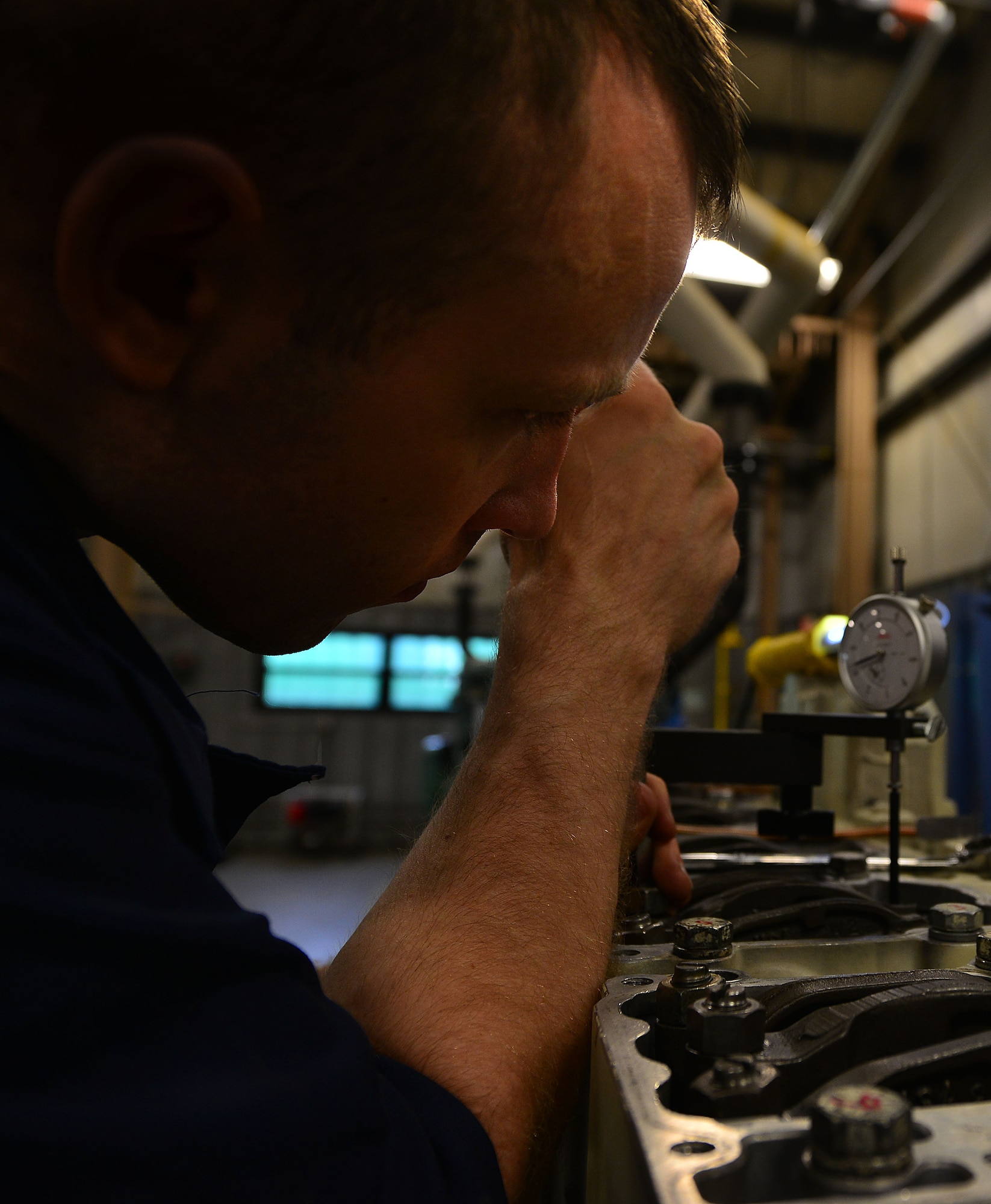 U.S. Army Warrant Officer Lewis Bryce, 2nd Staff and Faculty Company Marine Engineering Officer Basic Course student, checks the torque value of injectors and valves of a diesel Landing Craft Utility-2000 generator at Fort Eustis, Va., May 21, 2015.  Throughout the course, warrant officers learn how to engineer onboard any class of Army vessels. (U.S. Air Force photo by Staff Sgt. Natasha Stannard/Released)