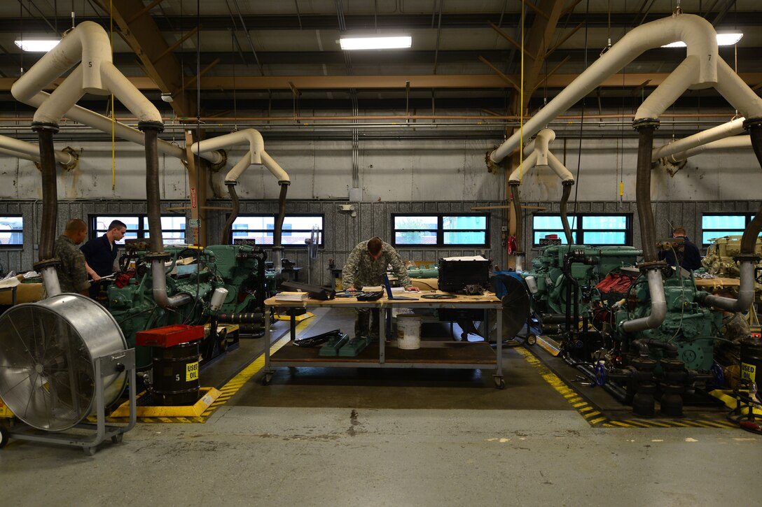 U.S. Army 2nd Staff and Faculty Company Watercraft Engineer Certification Course students rebuild Detroit diesel 12-V-71 series main propulsion engines at Fort Eustis, Va., May 21, 2015. During the course, students learn maintenance procedures and how to repair Army vessels. (U.S. Air Force photo by Staff Sgt. Natasha Stannard/Released)