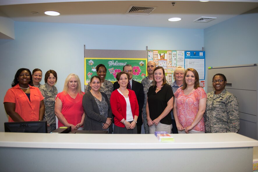 Members from the 23d Medical Group and the Georgia Department of Public Health pose for a photo during the grand opening of Moody’s Women, Infants, and Children Program at the pediatric clinic May 21, 2015, at Moody Air Force Base, Ga. WIC will provide Department of Defense cardholders who qualify with free food vouchers, education about healthy eating habits and referrals to other social services. (U.S. Air Force photo by Airman Greg Nash/Released)