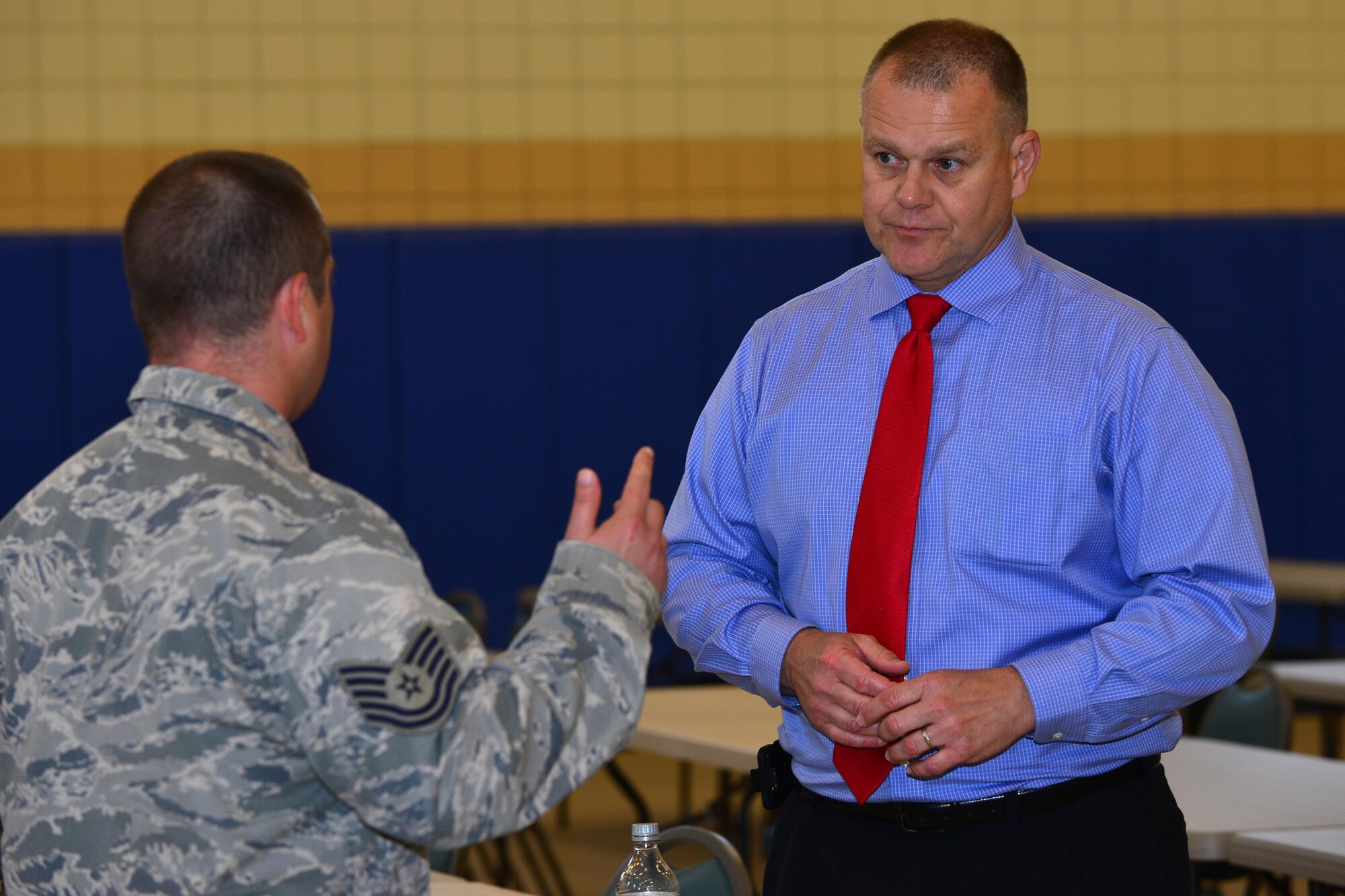 Retired Chief Master Sgt. of the Air Force James Roy speaks with noncommissioned officers after an NCO roundtable discussion at Langley Air Force Base, Va., May 20, 2015. After the roundtable, Roy answered individual questions and took photos with those who attended. (U.S. Air Force photo by Staff Sgt. Natasha Stannard/Released)