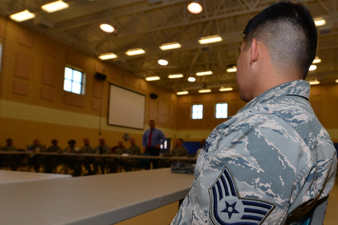 U.S. Air Force noncommissioned officers listen as retired Chief Master Sgt. of the Air Force James Roy begins a roundtable discussion at Langley Air Force Base, Va., May 20, 2015. During the discussion, the group had the opportunity to address concerns within the Air Force, and also discussed what it means to be an Airman. (U.S. Air Force photo by Staff Sgt. Natasha Stannard/Released)
