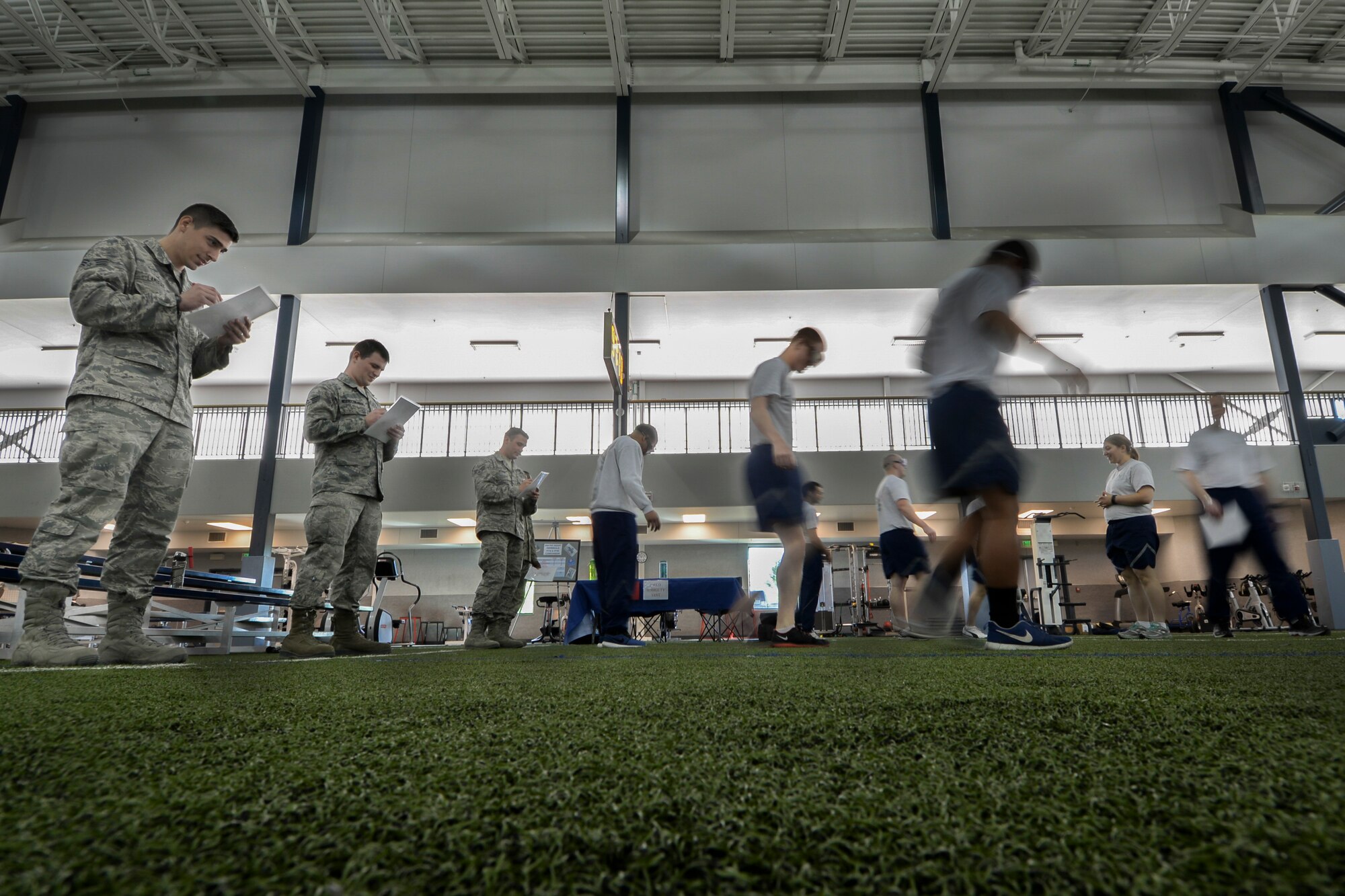 U.S. Air Force Airmen assigned to the 354th Fighter Wing practice a field sobriety test while wearing drunk goggles during the Alcohol Awareness and Safety Expo May 21, 2015, at the Baker Field House on Eielson Air Force Base, Alaska. The purpose of the test was to imitate inebriation and show that balance is lost when intoxicated. (U.S. Air Force photo by Senior Airman Ashley Nicole Taylor/Released)