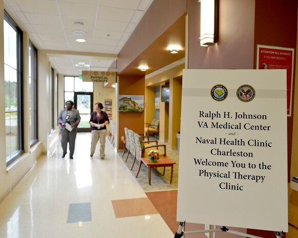 Staff members tour the waiting area outside of the new joint VA-DoD Physical Therapy Clinic at Naval Health Clinic Charleston during a grand opening event May 20, 2015. The clinic, which is located at Joint Base Charleston - Weapons Station, S.C., is staffed by VA medical professionals, to include: two physical therapists, two physical therapy assistants and a medical services support assistant. (Courtesy Photo / Ralph H.
Johnson VA Medical Center)

