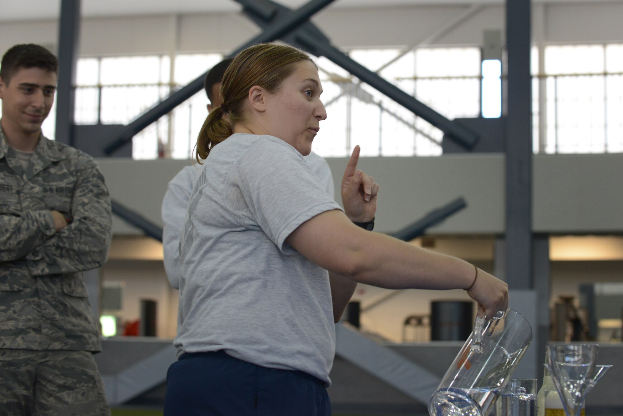 U.S. Air Force Staff Sgt. Candice Keene, the 354th Communications Squadron spectrum manager, pours an example of one serving of alcohol during the Alcohol Awareness and Safety Expo May 21, 2015, at the Baker Field House on Eielson Air Force Base, Alaska. The purpose of the station was to show how the average person over-estimates a typical serving of alcohol. (U.S. Air Force photo by Senior Airman Ashley Nicole Taylor/Released)