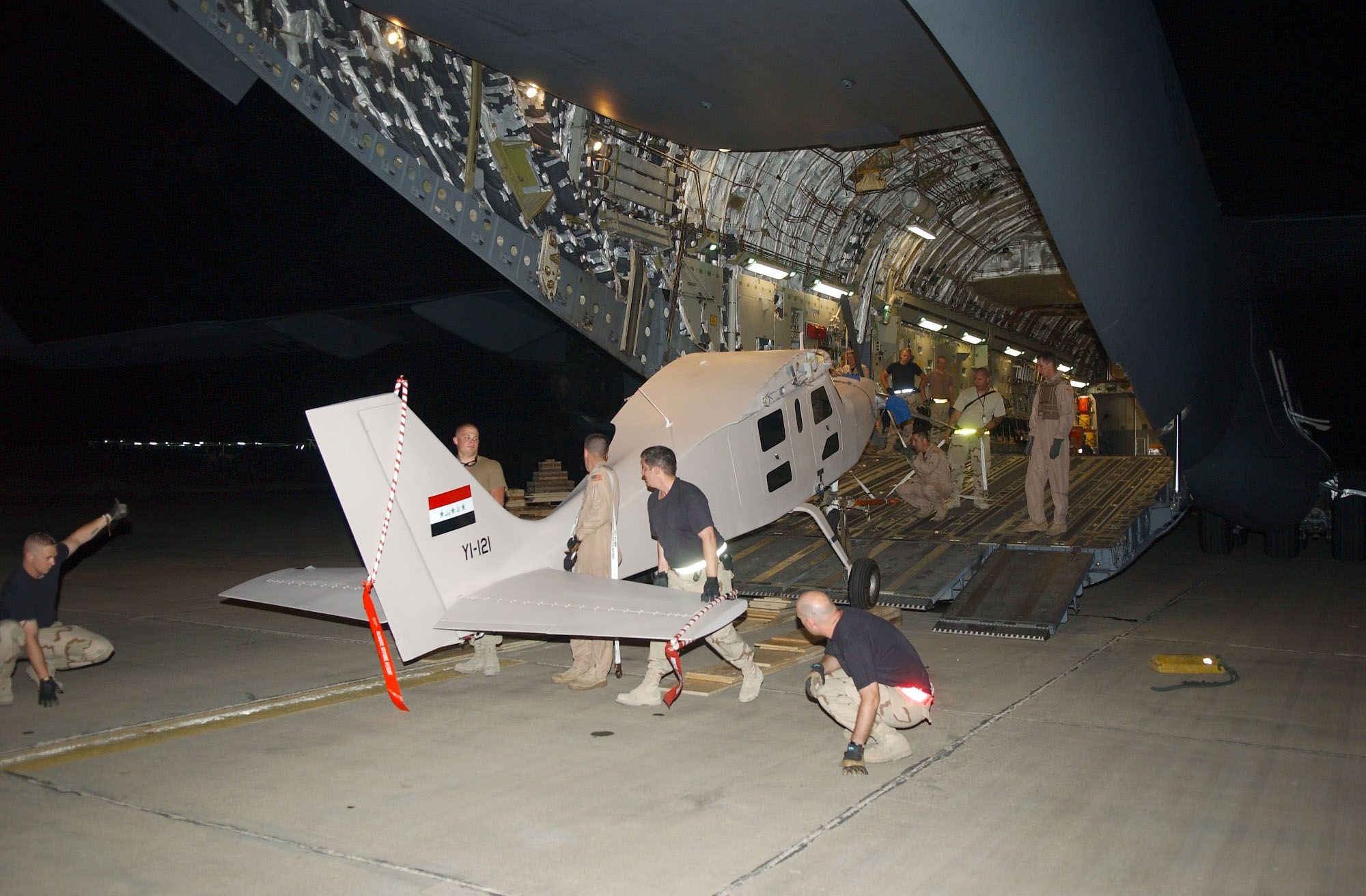 A Comp Air 7SLX is unloaded from a C-17 at Kirkuk Air Base, Iraq, for testing as a potential aerial reconnaissance vehicle for the Iraqi Military. (U.S. Air Force photo/332nd AEW PA)