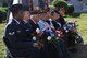 Representatives of various active duty and retired military organizations hold bouquets of flowers during the Memorial Day Ceremony at the Tom Green County Courthouse in San Angelo, Texas, May 26, 2015. The flowers were later laid upon the veteran memorial. (U.S. Air Force photo by Senior Airman Michael Smith/Released)