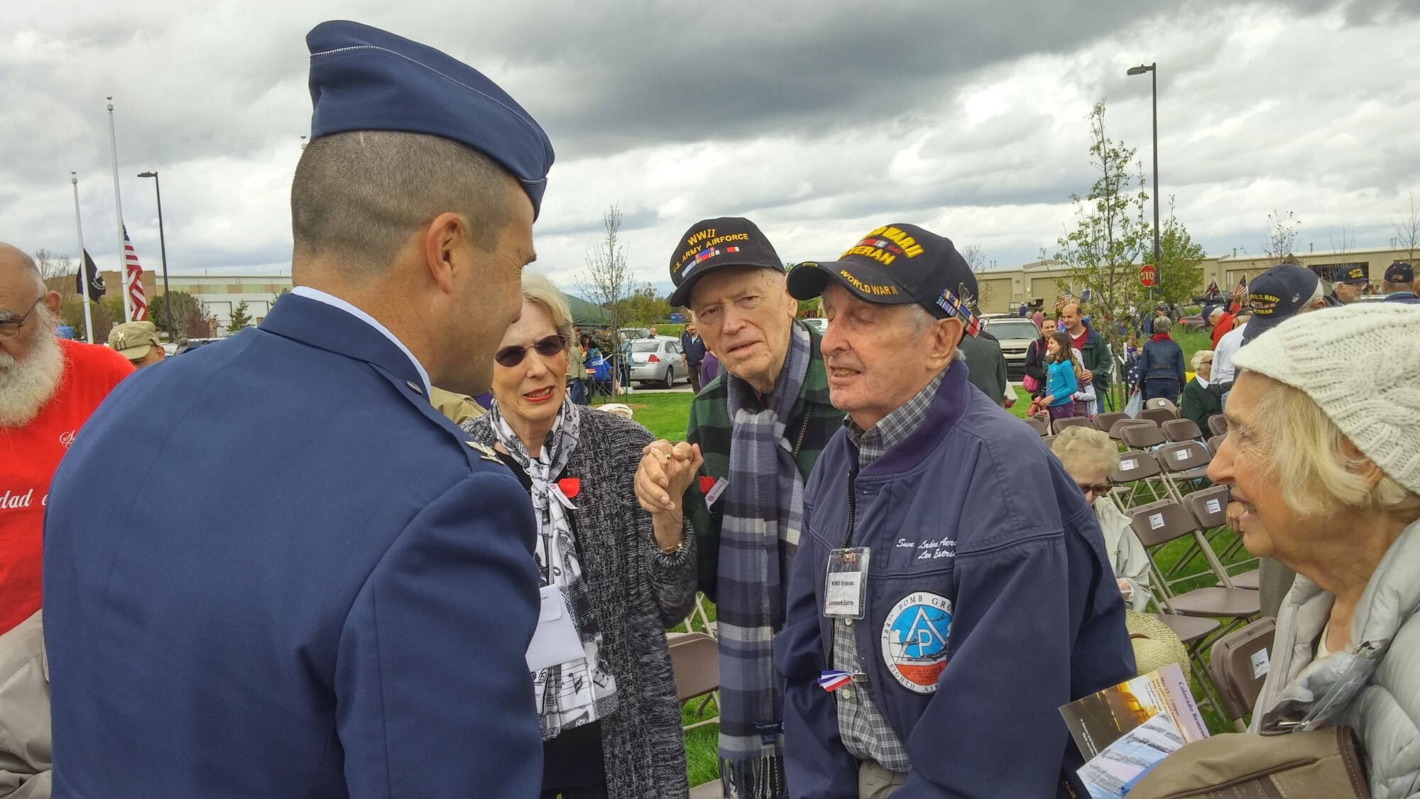 Col. John Wagner, 460th Space Wing commander, speaks with World War II veterans during the Memorial Day ceremony May 23, 2015, at the Colorado Freedom Memorial in Aurora, Colorado. This year’s ceremony had multiple guest speakers, flyovers, military displays and also marked the 70th anniversary of the end of World War II. (courtesy photo)