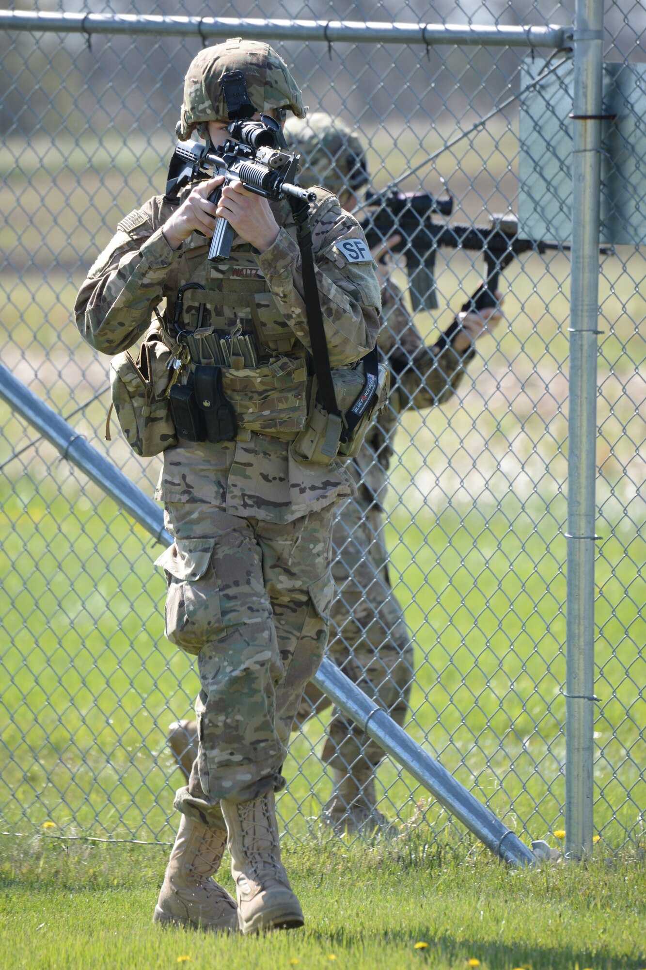 From left to right 219 Security Forces Squadron members Senior Airman Tyler Waltz and Airman 1st Class Alex Pauling conduct an area sweep of a Minot Air Force Base missile alert facility May 21, 2015, near Minot, North Dakota. Sweeps are routinely done for training, as a result of an alarm being set off, or periodically because time has passed between sweeps. The North Dakota Air National Guard members are doing their annual training period as they perform the real-World mission of missile field security, and train for their war-time tasking mission. The Air National Guard members are routinely integrated among the U.S. Air Force active duty personnel performing missile field security in a seamless and indistinguishable manner. (U.S. Air National Guard photo by Senior Master Sgt. David H. Lipp/Released)