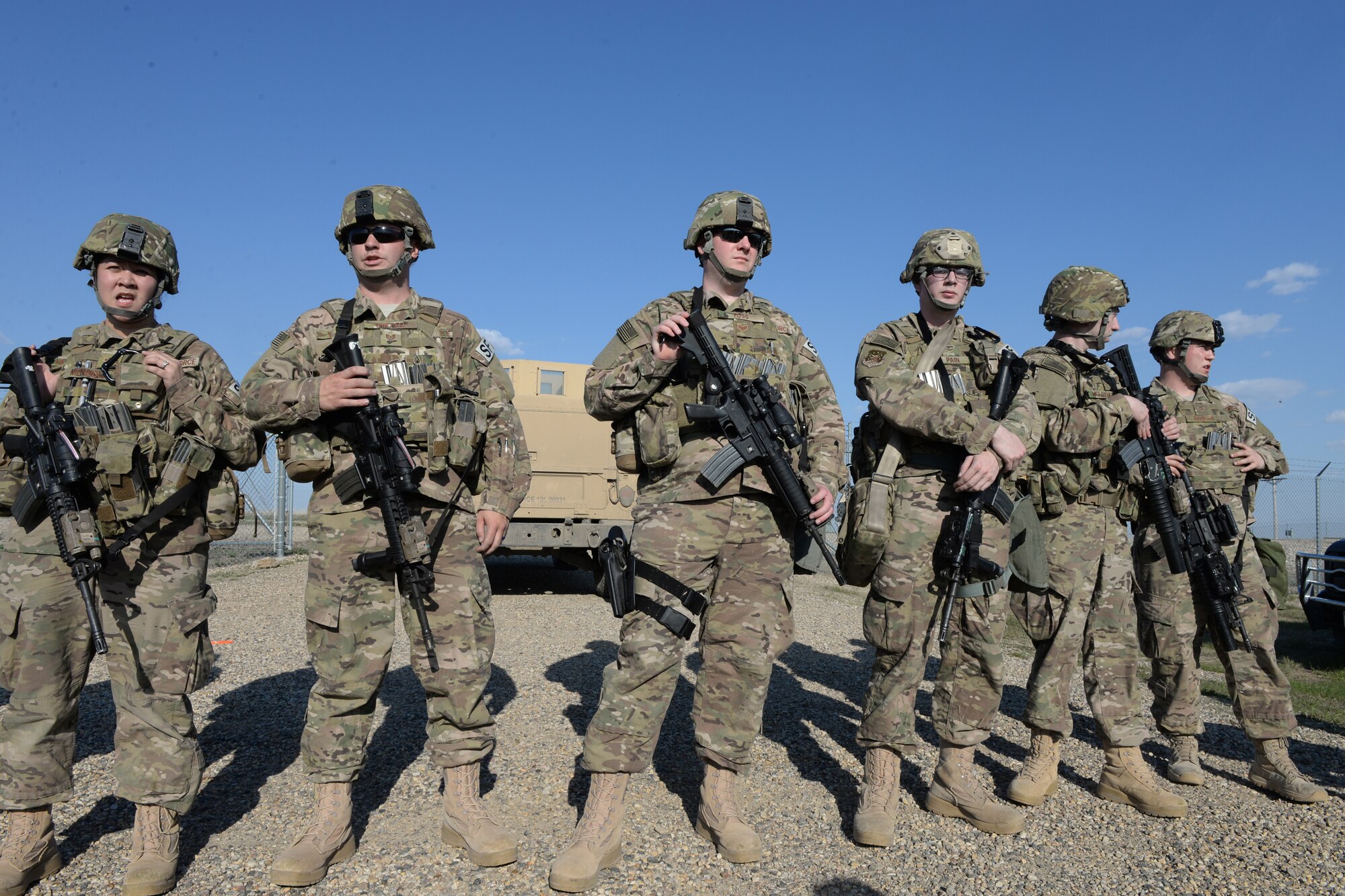 U.S. Air Force and North Dakota Air National Guard personnel in the 91st Missile Security Forces Squadron and the 219th Security Forces Squadron from left to right Staff Sgt. Shareen Mendiola, Tech. Sgt. Nicholas Van Pelt, Staff Sgt. Erik Foss, Airman 1st Class Joseph Pain, Senior Airman Michael McLaughlin and Airman 1st Class Bradley Rayburn listen to a briefing at the conclusion of an exercise at a Minot Air Force Base, North Dakota, launch facility May 20, 2015. The exercise included an intermingled combination of North Dakota Air National Guard members doing their annual training and 91st Missile Security Forces Squadron members performing their day-to-day duties. The Air National Guard members are routinely integrated among the U.S. Air Force active duty personnel as they perform the real-World mission of missile field security in a seamless and indistinguishable manner. (U.S. Air National Guard photo by Senior Master Sgt. David H. Lipp/Released)