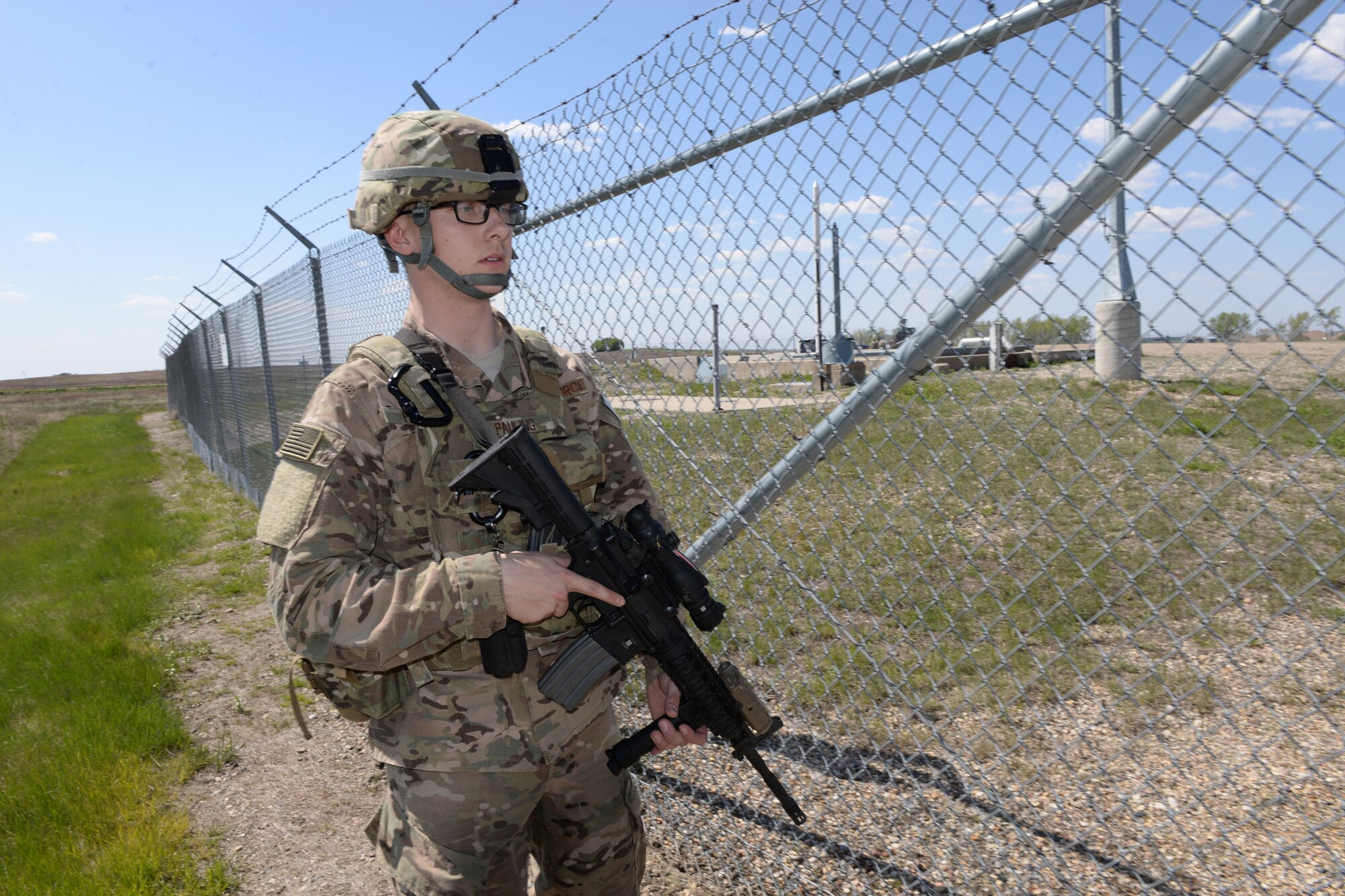 Airman 1st Class Alex Pauling, of the 219th Security Forces Squadron performs a sweep of the area for anything suspicious at a Minot Air Force Base, North Dakota, launch facility May 20, 2015. The exercise included an intermingled combination of North Dakota Air National Guard members doing their annual training and 91st Missile Security Forces Squadron members performing their day-to-day duties. The Air National Guard members are routinely integrated among the U.S. Air Force active duty personnel as they perform the real-World mission of missile field security in a seamless and indistinguishable manner. (U.S. Air National Guard photo by Senior Master Sgt. David H. Lipp/Released)