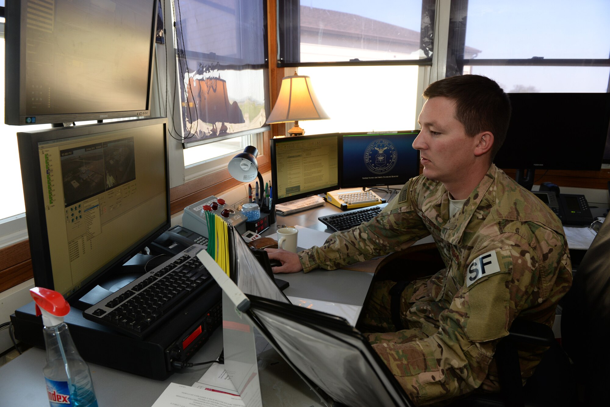 Staff Sgt. Shawn Mcelyea, of the 219th Security Forces Squadron, monitors remote video cameras at the command center of a Minot Air Force Base, North Dakota, missile alert facility May 20, 2015. Mcelyea is one of several North Dakota Air National Guard enlisted members who are doing their annual training while performing the real-World mission of missile field security, which allows their active duty counterparts to catch up on other training and mission requirements. Air National Guard members are routinely integrated among the U.S. Air Force active duty personnel performing missile field security in a seamless and indistinguishable manner. (U.S. Air National Guard photo by Senior Master Sgt. David H. Lipp/Released)