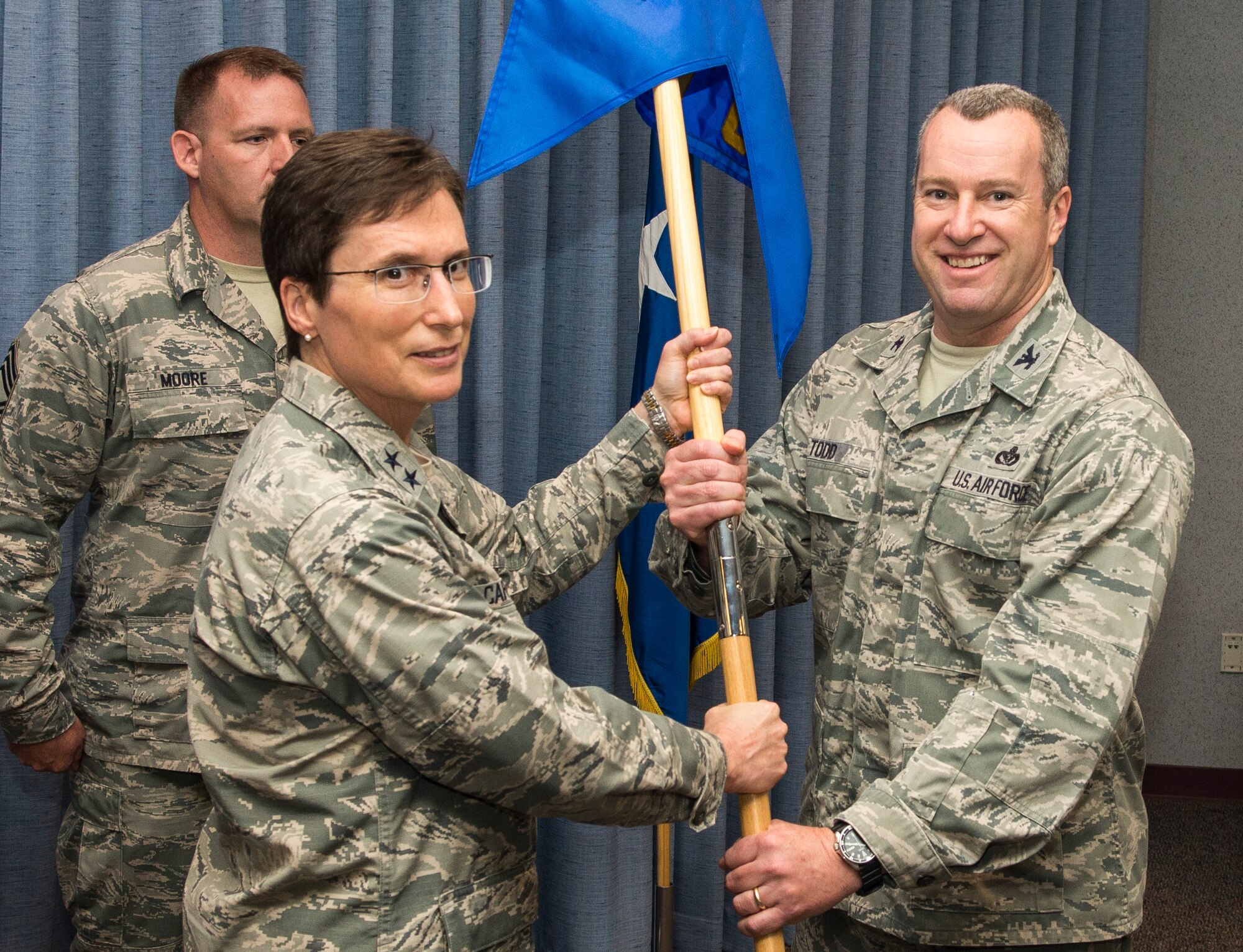 Col. Jeffrey Todd assumes command of Air Force Installation and Mission Support Center Detachment 6 from Maj. Gen. Theresa Carter, AFIMSC commander, during a ceremony at Wright-Patterson Air Force Base, Ohio, May 26, 2015. Todd will serve as the interim commander of Detachment 6, which is the last of 10 AFIMSC detachments to be activated across the Air Force. (U.S. Air Force photo/Wesley Farnsworth)