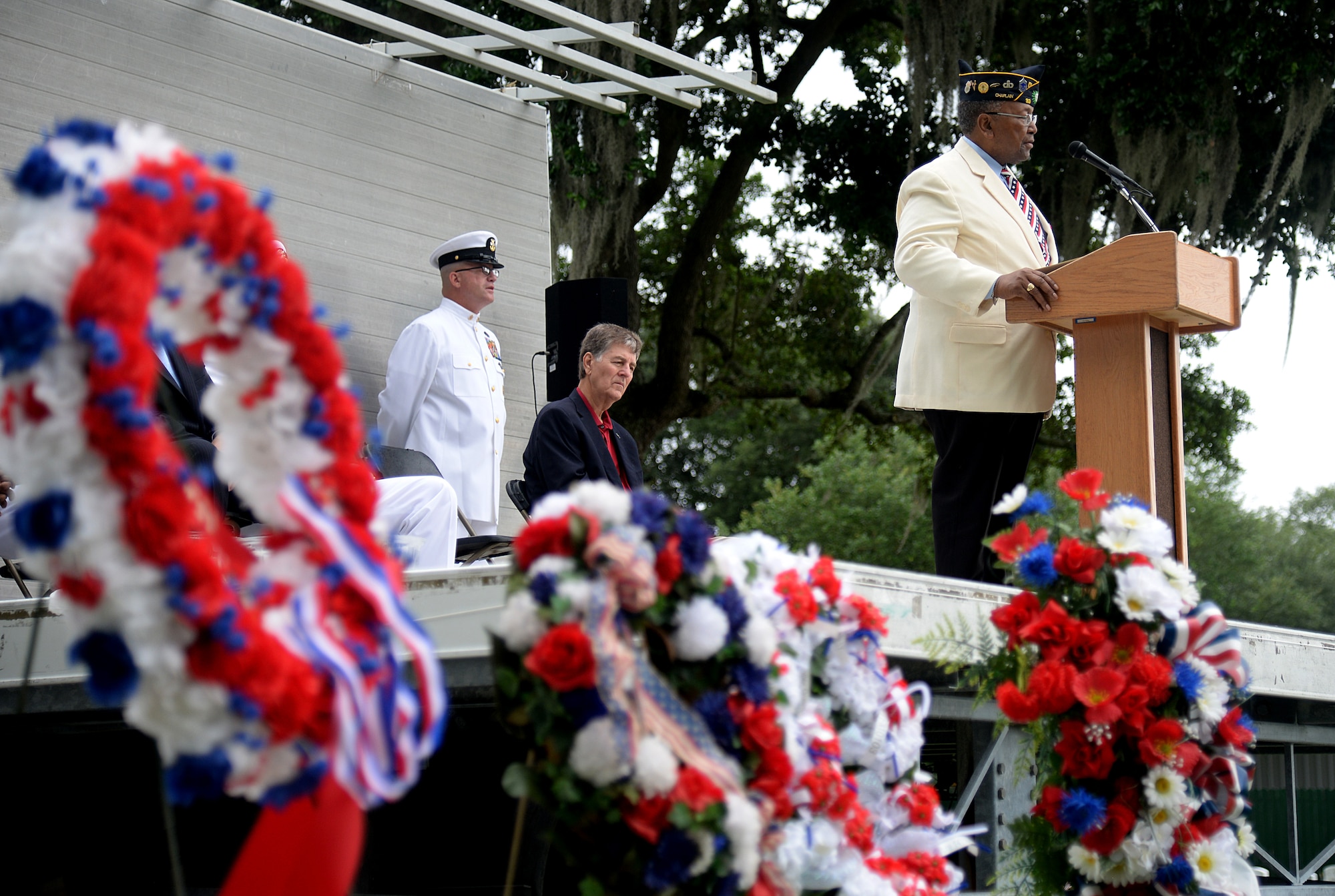 Retired Air Force Chief Master Sgt. Chris Moore sings “Amazing Grace” at the 2015 Biloxi National Cemetery Memorial Day ceremony, May 25, 2015, Biloxi, Miss. Local veterans, family members and Local veterans, family members and Keesler Air Force Base and Naval Construction Battalion Center leadership attended to honor and remember the lives of fallen U.S. military heroes. (U.S. Air Force photo by Senior Airman Holly Mansfield)