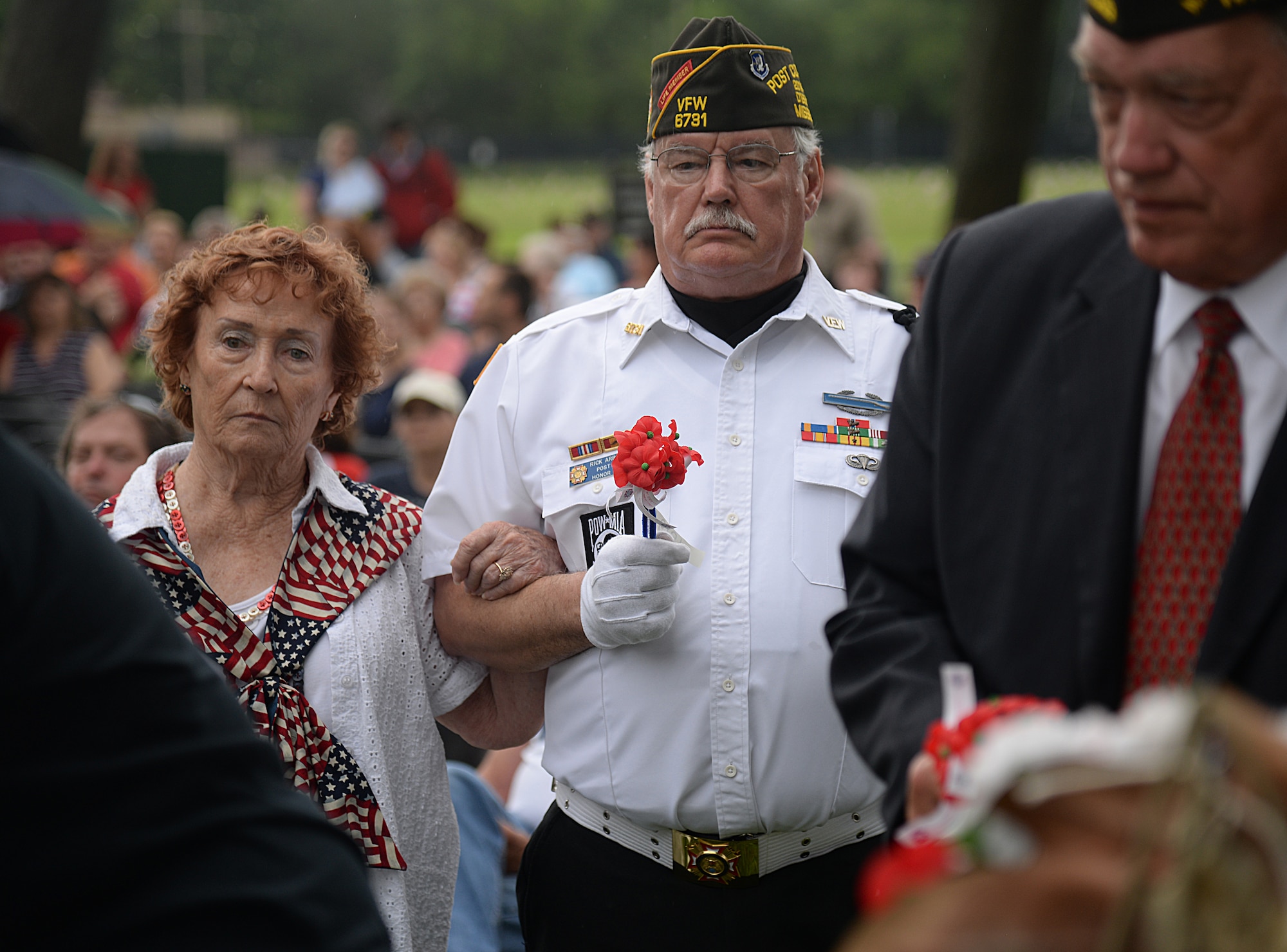 The D’Iberville, Mississippi Veterans of Foreign Wars group post commander waits to put a poppy flower on a wreath at the 2015 Biloxi National Cemetery Memorial Day ceremony, May 25, 2015, Biloxi, Miss. Local veterans, family members and Keesler Air Force Base and Naval Construction Battalion Center leadership attended to honor and remember the lives of fallen U.S. military heroes. (U.S. Air Force photo by Senior Airman Holly Mansfield)