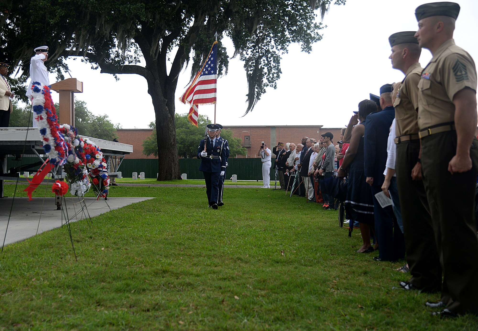 Keesler Honor Guard members post the colors at the 2015 Biloxi National Cemetery Memorial Day ceremony, May 25, 2015, Biloxi, Miss. Local veterans, family members and Keesler Air Force Base and Naval Construction Battalion Center leadership attended to honor and remember the lives of fallen heroes of the U.S. military. (U.S. Air Force photo by Senior Airman Holly Mansfield)