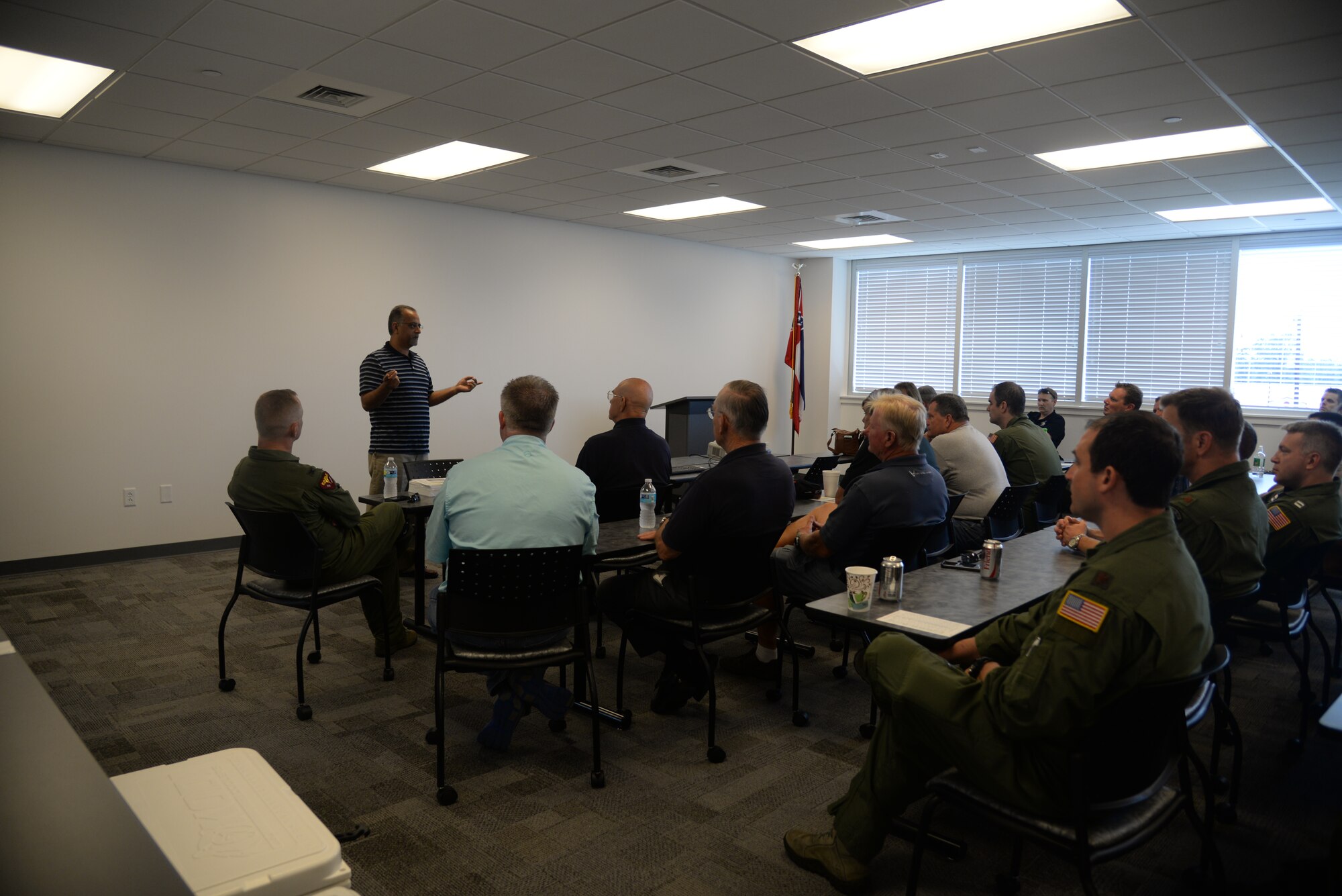 Turan Chowdhary, 81st Operations Support Flight terminal instrument procedure specialist, speaks at the Third Annual Fly-In Military-General Aviation Joint Safety Day, May 21, 2015, Stennis International Airport in Kiln, Miss. A product of the Mid-Air Collision Avoidance program, the event was held to increase communication and safety among surrounding military and civilian aviation communities. (U.S. Air Force photo by Senior Airman Holly Mansfield)