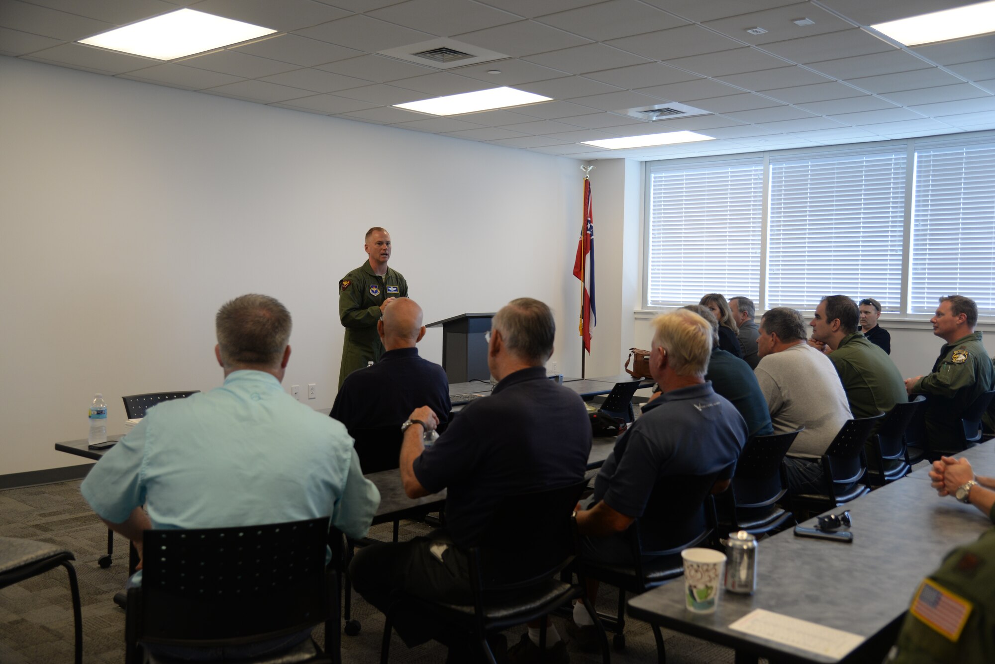 Col. Dennis Scarborough, 81st Training Wing vice commander, speaks at the Third Annual Fly-In Military-General Aviation Joint Safety Day, May 21, 2015, Stennis International Airport in Kiln, Miss. A product of the Mid-Air Collision Avoidance program, the event was held to increase communication and safety among surrounding military and civilian aviation communities.. (U.S. Air Force photo by Senior Airman Holly Mansfield)