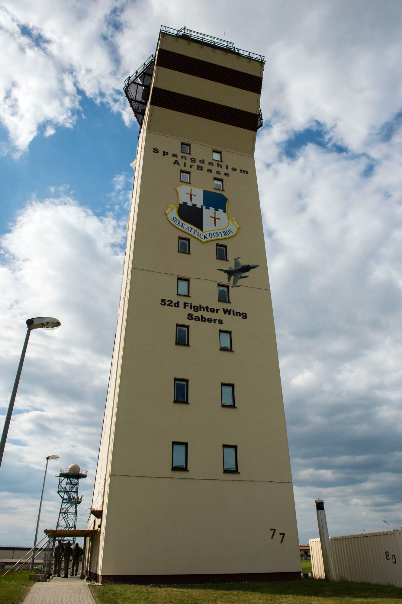 The air traffic control tower looks over the flightline at Spangdahlem Air Base, Germany, May 22, 2015. The tower stands nearly 150 feet tall and serves as a hub for air traffic controllers. Community and business leaders toured the air traffic control areas on the flightline as part of the 52nd Fighter Wing’s community relations program. (U.S. Air Force photo by Airman 1st Class Luke Kitterman/Released)  
 

