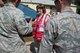 Dorthy Lanphear, clinical counselor and Red Cross volunteer, speaks to Airmen from Sheppard Air Force Base, Texas, about which rooms need carpet removed from homes in Wichita Falls, May 26, 2015. Airmen worked side-by-side with United Way and Red Cross to help the local community recover from flood damage. (U.S. Air Force photo by Senior Airman Kyle Gese/Released)