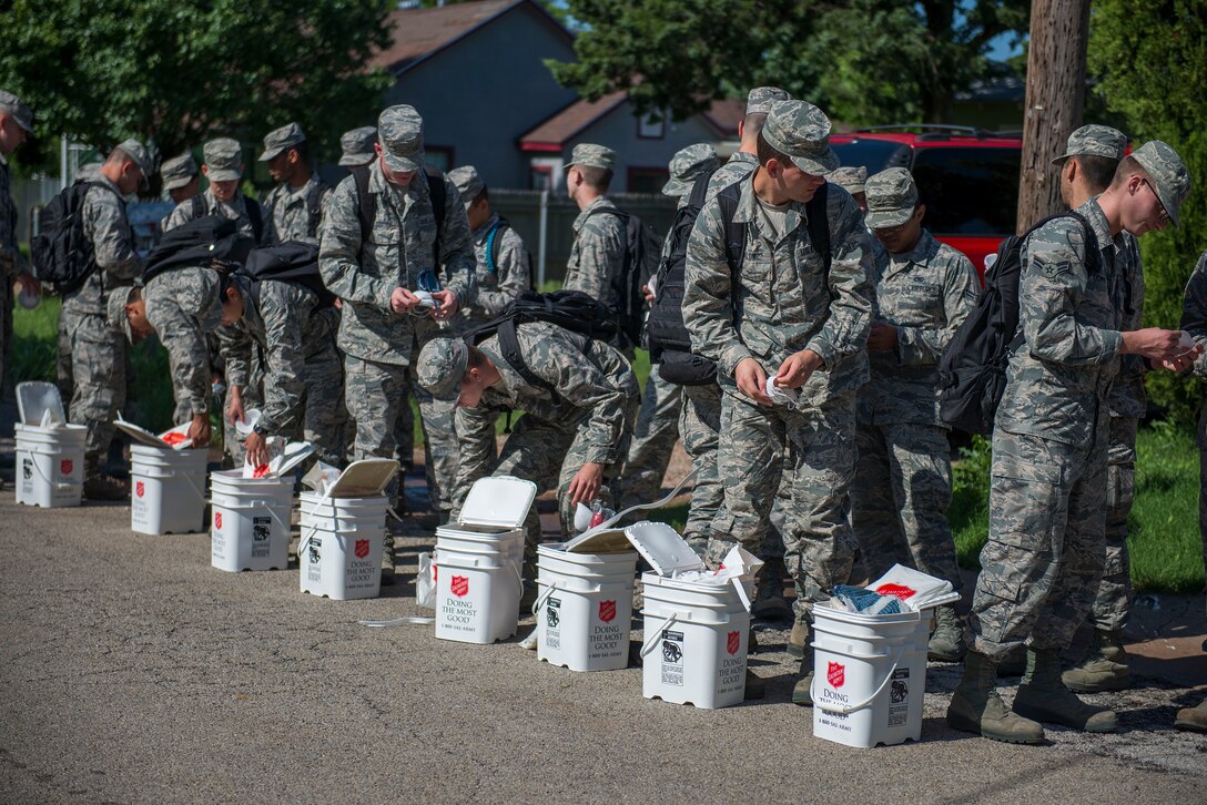 U.S. Air Force Airmen from Sheppard Air Force Base, Texas, prepare to help the local community remove damaged carpet and furniture caused by flooding in Wichita Falls, May 26, 2015. Approximately 40 Airmen volunteered to help United Way with disaster response. (U.S. Air Force photo by Senior Airman Kyle Gese/Released)