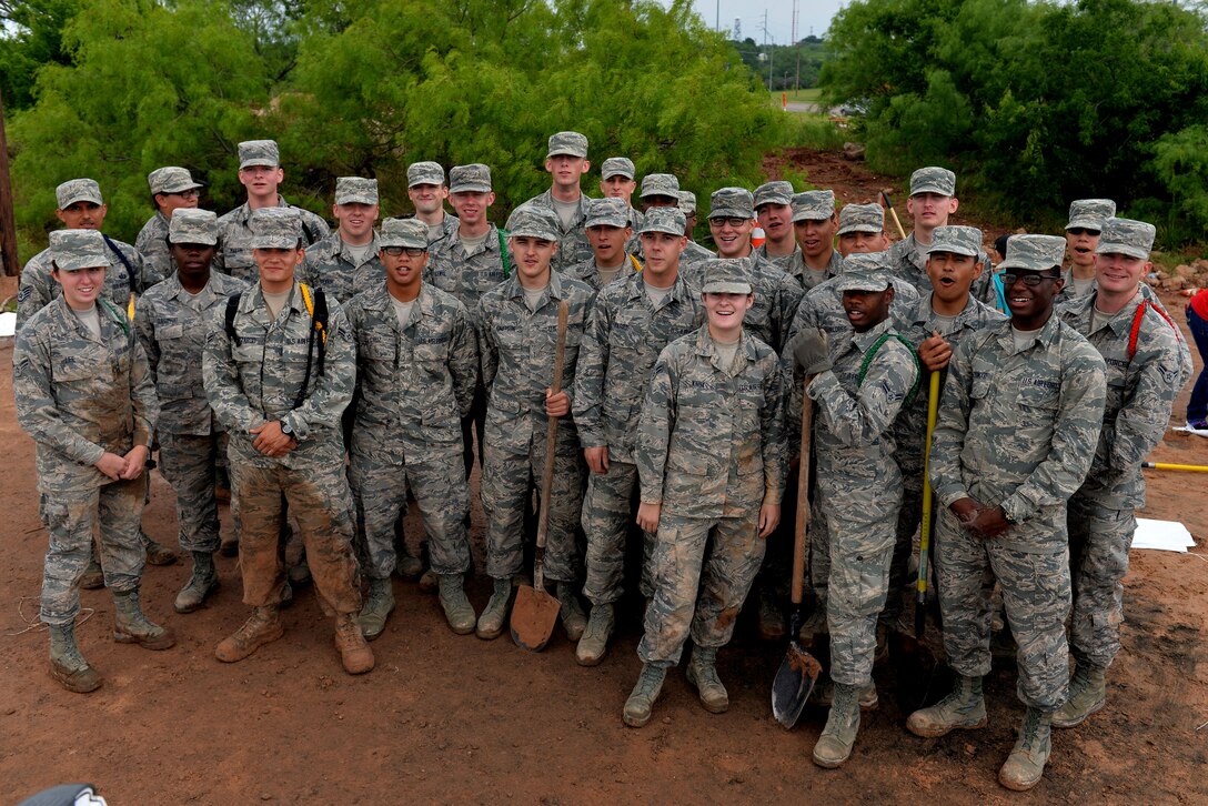 U.S. Air Force Airmen from Sheppard Air Force Base, Texas, take a break from filling sandbags that would be used to help the community prepare for potential flooding in Wichita Falls, May 23, 2015. These Airmen worked side-by-side with the local community to help minimize the risk of flood damage. (U.S. Air Force photo by Senior Airman Kyle Gese/Released)