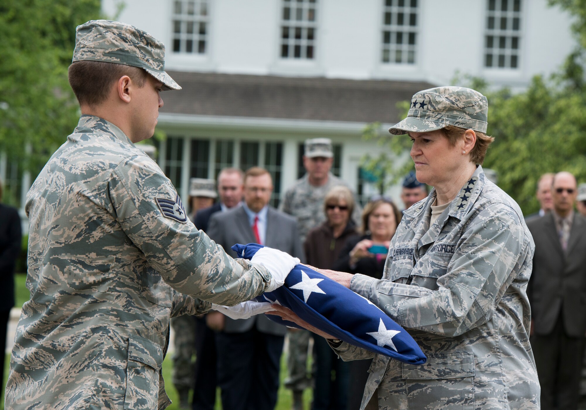 Gen. Janet C. Wolfenbarger, Air Force Materiel Command commander, accepts
the flag from a member of the flag detail at her final retreat ceremony May
21 at Wright-Patterson Air Force Base. Wolfenbarger will end a 35-year Air
Force career when she retires in early June. (U.S. Air Force photo/Wesley
Farnsworth)

