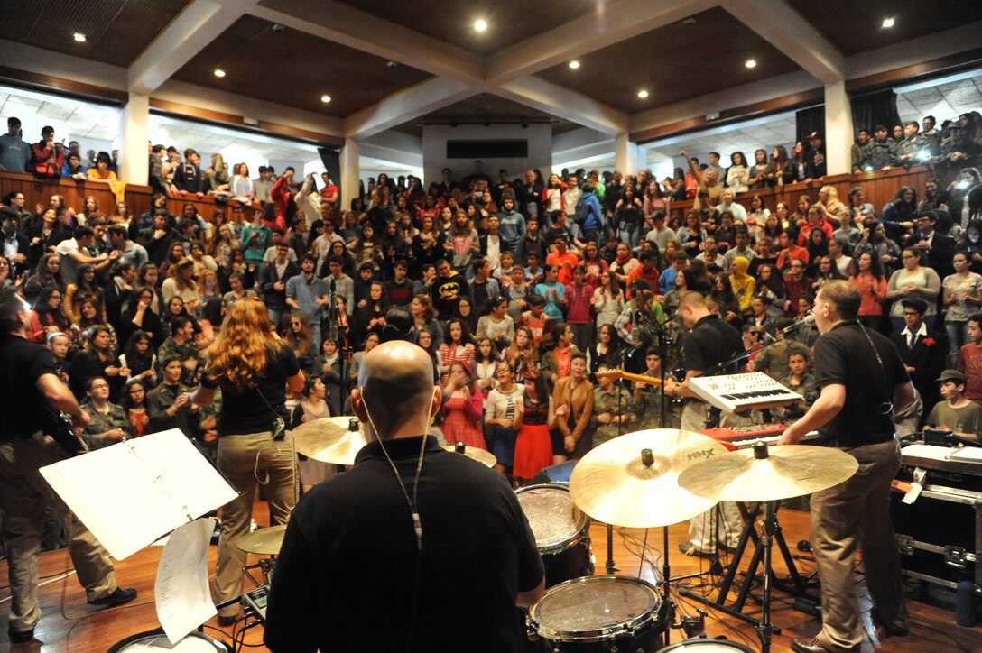 The U.S. Air Forces in Europe Band’s music group, Touch n’ Go performed at numerous locations across the island of Terceira as part of community outreach efforts,  April 23-26, 2015. The performances allowed the Air Force to connect with members of the community to thank them for their support over the years.  In this photo Staff Sergeant Jon Friedman performs for an enthusiastic group of students at Praia High School.  (U.S. Air Force photo by Mr. Guido Melo)