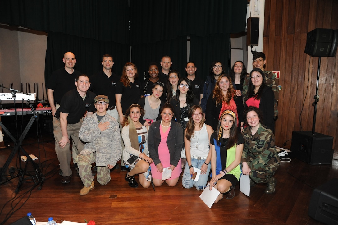 The U.S. Air Forces in Europe Band’s music group, Touch n’ Go performed at numerous locations across the island of Terceira as part of community outreach efforts,  April 23-26, 2015. The performances allowed the Air Force to connect with members of the community to thank them for their support over the years. This photo features the members of Touch n' Go with students at Praia High School.  (U.S. Air Force photo by Mr.Guido Melo)