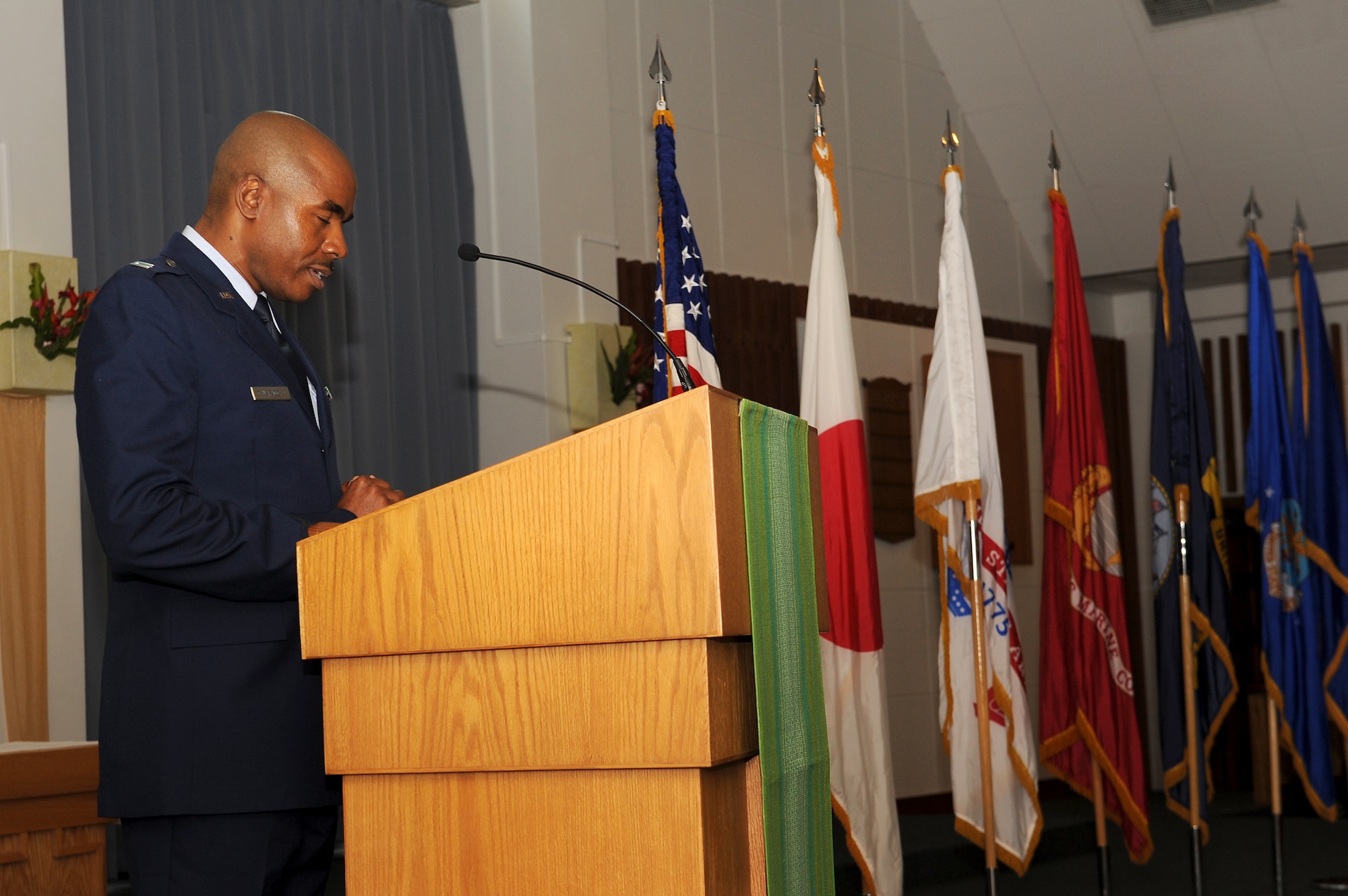 U.S. Air Force Capt. Emmanuel Okwaraocha, 18th Wing chaplain, provides the invocation during a Memorial Day ceremony at Chapel 1 on Kadena Air Base, Japan, May 25, 2015. The ceremony was attended by leadership and veterans from all branches of service on Okinawa and other personnel who chose to gather to remember the men and women who have died while serving in the U.S. armed forces. (U.S. Air Force photo by Airman 1st Class Zade C. Vadnais)