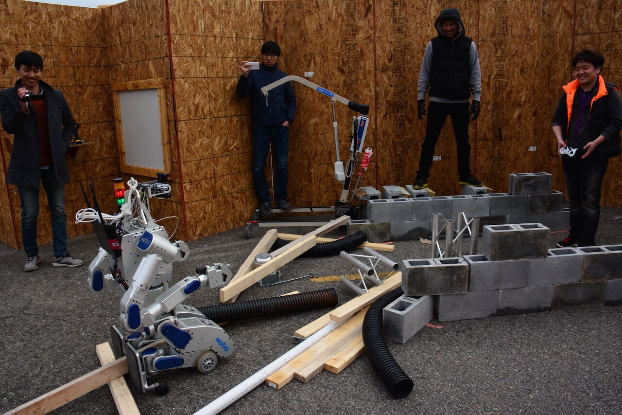 Team KAIST, from Daejeon, South Korea, and its robot DRC-HUBO negotiate mock rubble at a test site March 6, 2015. DARPA photo