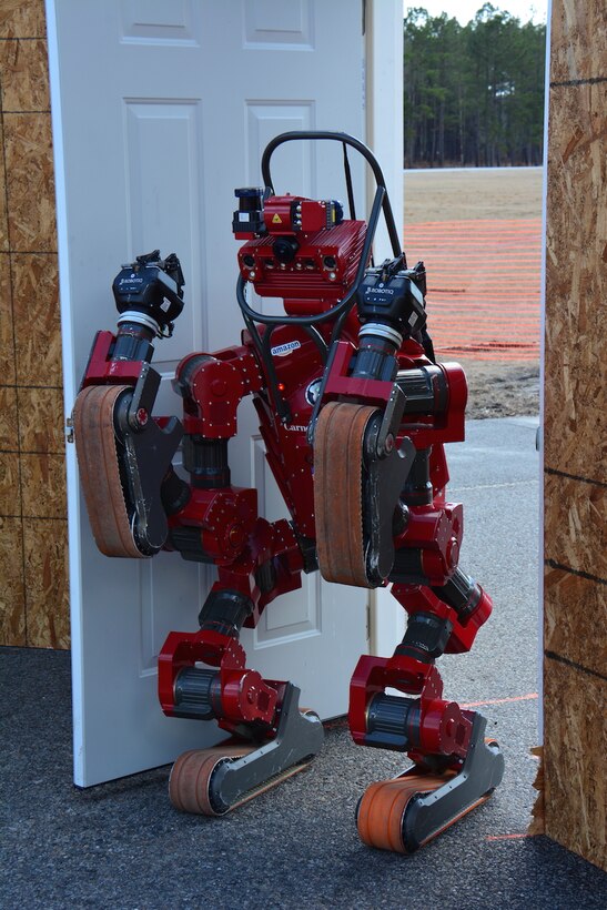 CHIMP, the Carnegie Mellon University National Robotics Engineering Center team’s robot, opens door at a test site March 4, 2015. DARPA photo