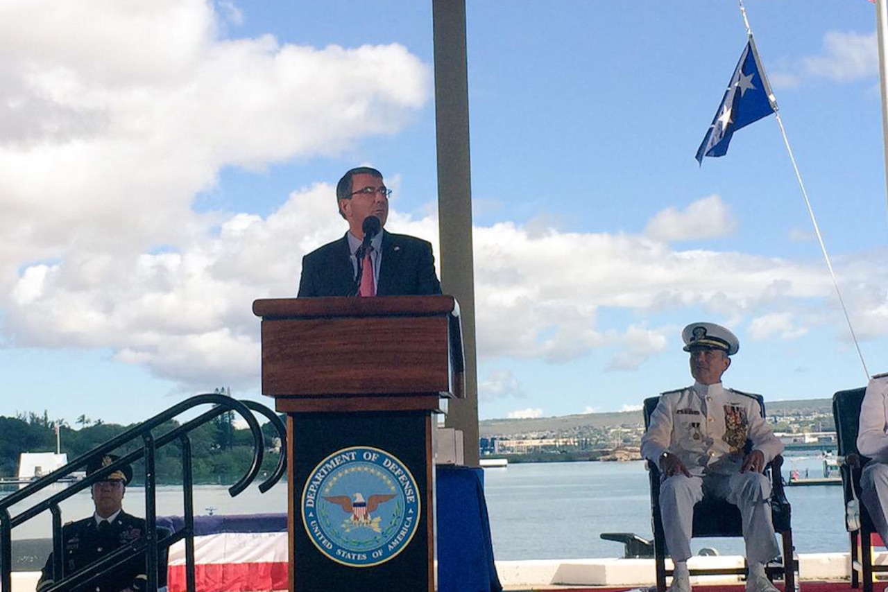 Defense Secretary Ash Carter addresses attendees at the U.S. Pacific Command and U.S. Pacific Fleet change-of-command ceremonies in Honolulu, May 27, 2015. Navy Adm. Harry B. Harris, who previously commanded U.S. Pacific Fleet, assumed command of Pacom from Navy Adm. Samuel J. Locklear III. Carter’s stop in Hawaii is his first in a 10-day trip to advance the next phase of the Asia-Pacific rebalance. DoD photo