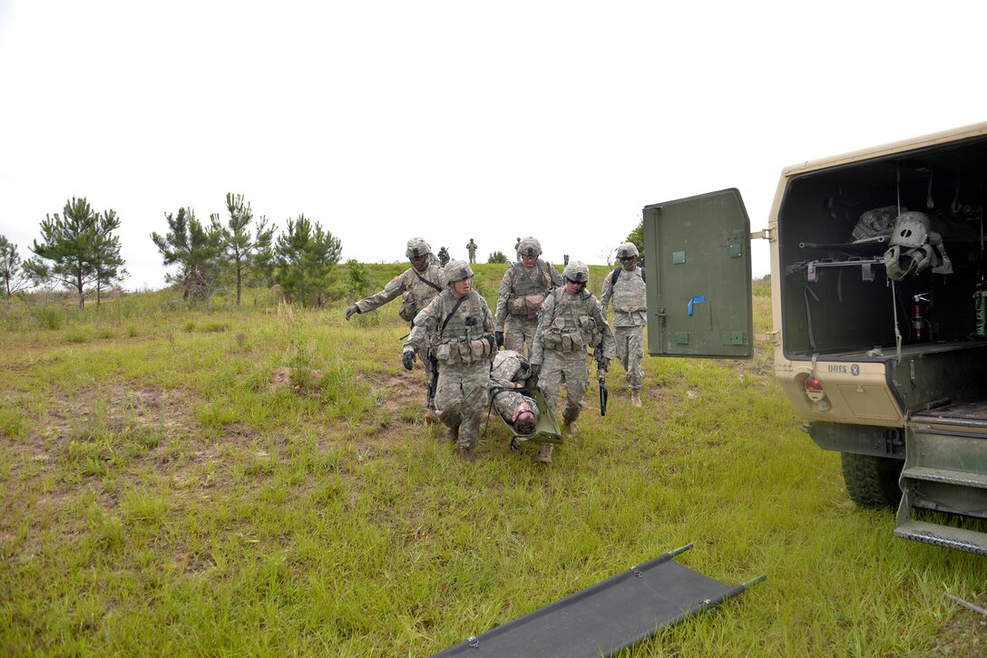 Soldiers evacuate a simulated casualty during a combined arms live-fire exercise on Fort Benning, Ga., May 15, 2015.