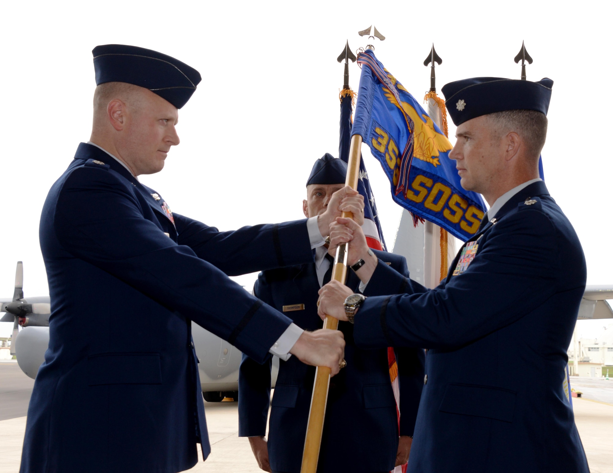 Lt. Col. Brent Nestor, 353rd Special Operations Support Squadron incoming commander, accepts the guidon from Lt. Col. John Trube, 353rd Special Operation Group deputy commander, during a Change of Command ceremony held May 21, 2015 on Kadena Air Base, Japan.  The 353rd SOSS executes operations, planning, intelligence, and communications support functions for the 353rd SOG.  (U.S. Air Force photo by Tech. Sgt. Kristine Dreyer)
