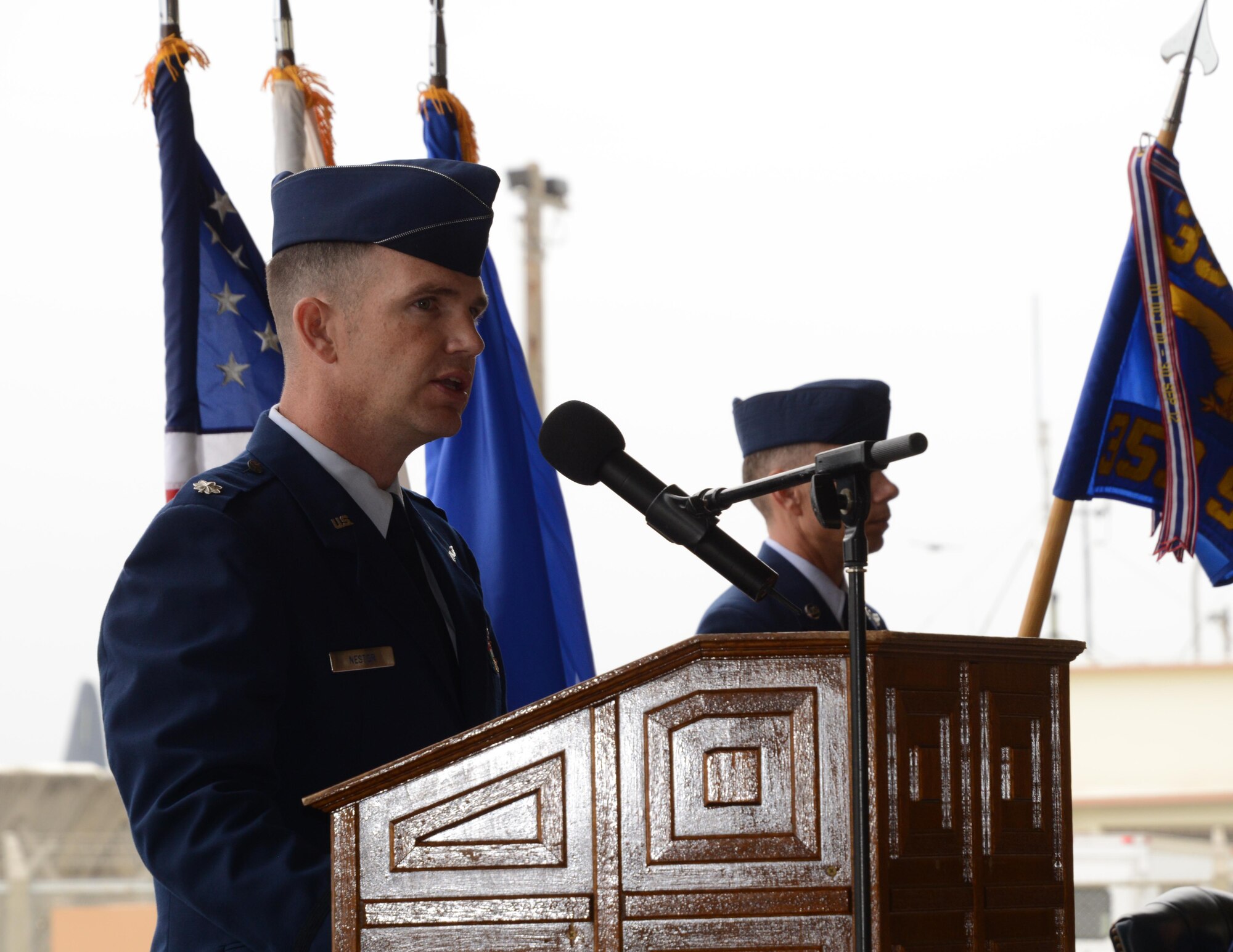 Lt. Col. Brent Nestor, 353rd Special Operations Support Squadron incoming commander, accepts the guidon from Lt. Col. John Trube, 353rd Special Operation Group deputy commander, during a Change of Command ceremony held May 21, 2015 on Kadena Air Base, Japan.  The 353rd SOSS executes operations, planning, intelligence, and communications support functions for the 353rd SOG.  (U.S. Air Force photo by Tech. Sgt. Kristine Dreyer)