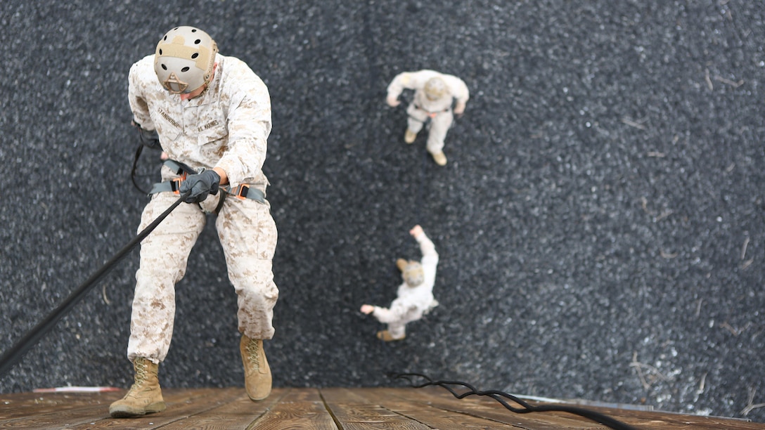 Staff Sgt. Brandon Stanbridge, a reconnaissance Marine with 1st Reconnaissance Battalion, ropes down a rappel tower in preparation for the 7th Annual Recon Challenge aboard Marine Corps Base Camp Pendleton, California, May 15, 2015. Rappelling is one of the many events that participants took part in during the 30-mile course.