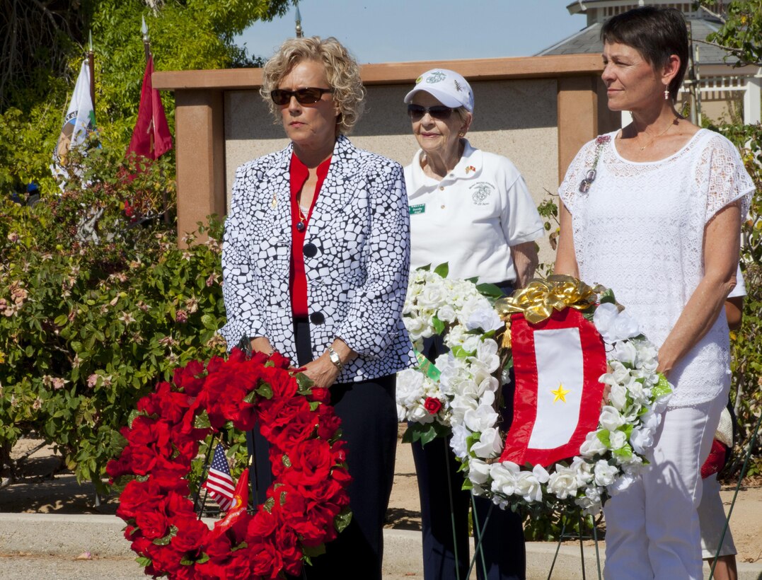 Laurie Craparotta, wife of Maj. Gen. Lewis A. Craparotta, Combat Center Commanding General; World War II veteran Dorothy Angil of the Woman Marine Association and Maria Simpson, Gold Star Mother of Lance Cpl. Abraham Simpson, stand together after presenting wreaths from their organizations at the Memorial Day Remembrance at the Twentynine Palms Public Cemetery, May 25, 2015. (Official Marine Corps photo by Kelly O'Sullivan/Released)