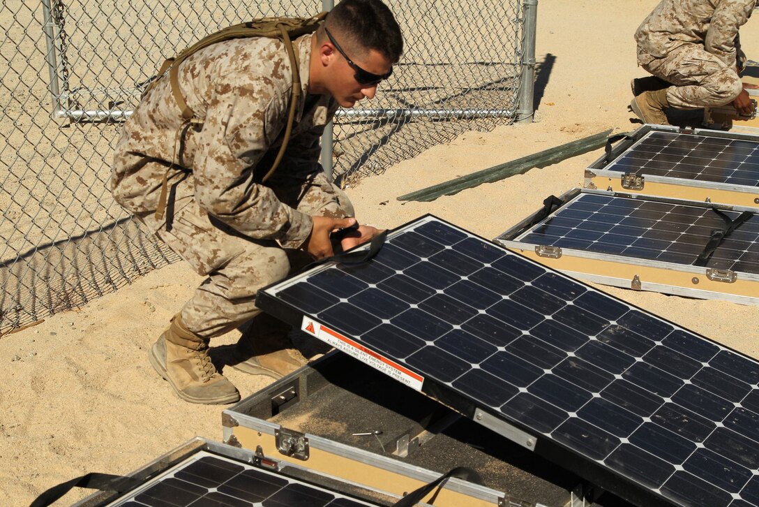 In preparation of Javelin Thrust 2012, Marines from Marine Forces Reserve and 2nd Tank Battalion, learn to setup and operate the Ground Renewable Expeditionary Energy Network System and the Solar Portable Alternative Communications Energy System during a training session conducted by personnel from Marine Forces Pacific Experimentation Center June 28, 2012. (Official US Marine Corps photo by Diane Durden / Released)