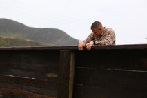 Master Sgt. David Jarvis, a reconnaissance Marine with 1st Reconnaissance Battalion, pushes over a wall during the obstacle course portion of the 7th Annual Recon Challenge aboard Marine Corps Base Camp Pendleton, Calif., May 15, 2015. Jarvis would go on to win the Recon Challenge with his partner, Capt. Patrick Zuber, a company commander for 1st Reconnaissance Battalion, with a time of 8 hours and 35 minutes.